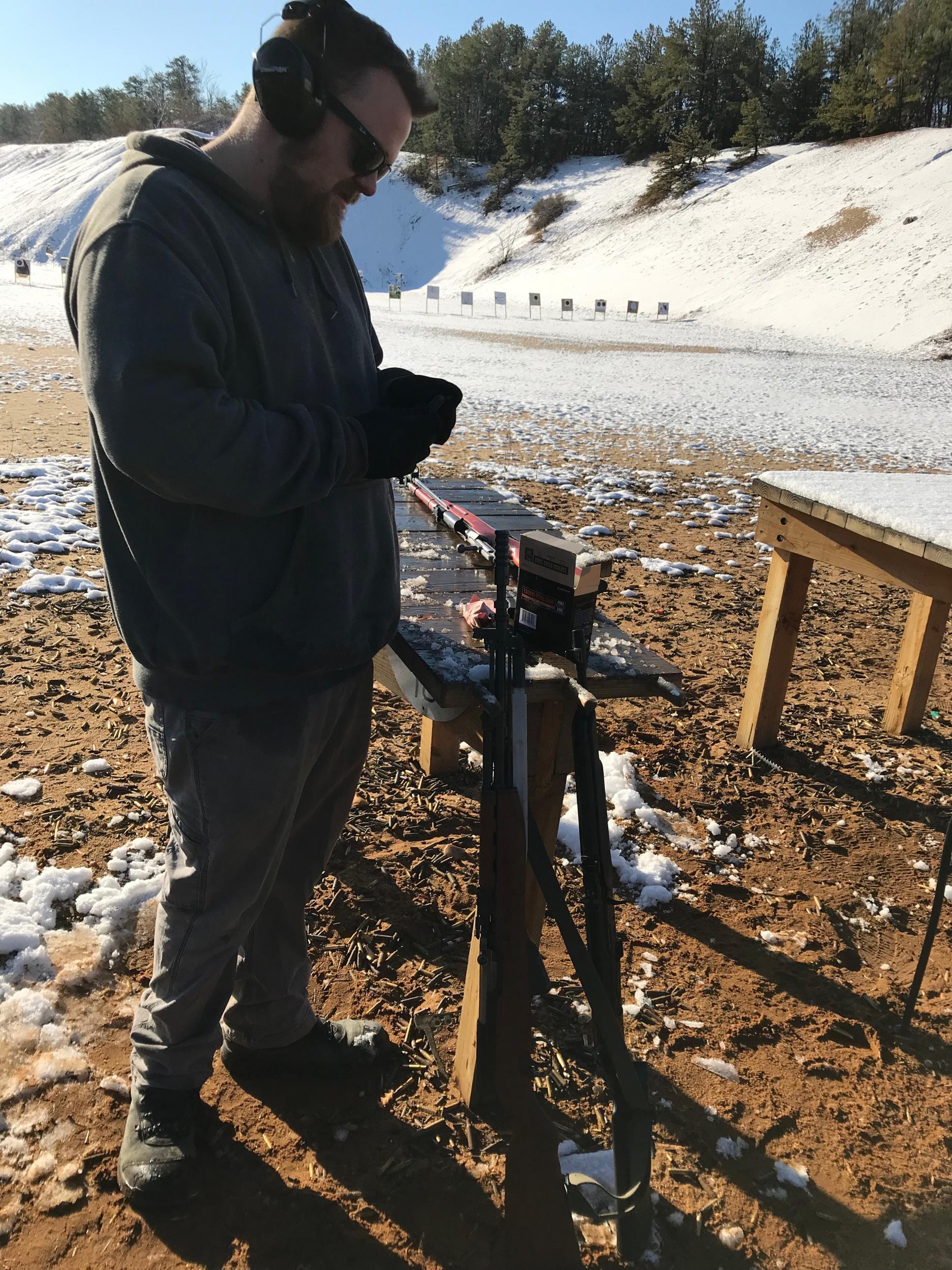 Mike sets up for a shot at the range