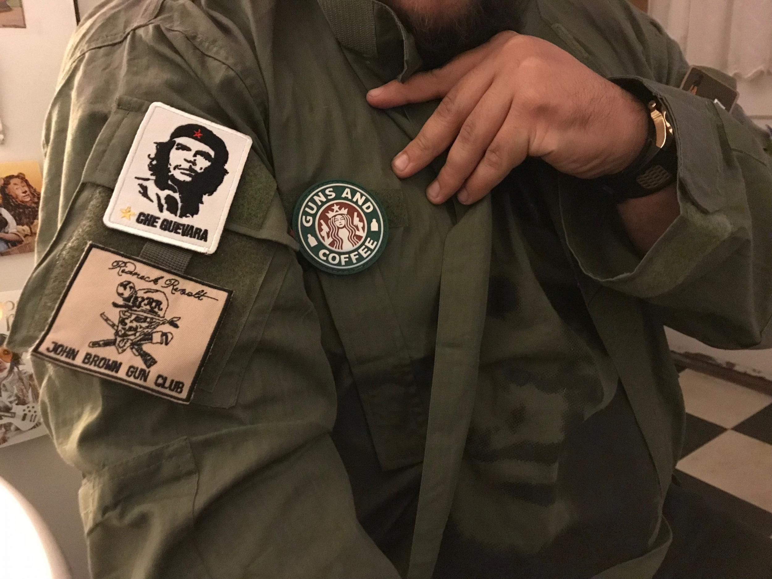 George shows off the Che Guevara and John Brown Gun Club patches on his sleeve