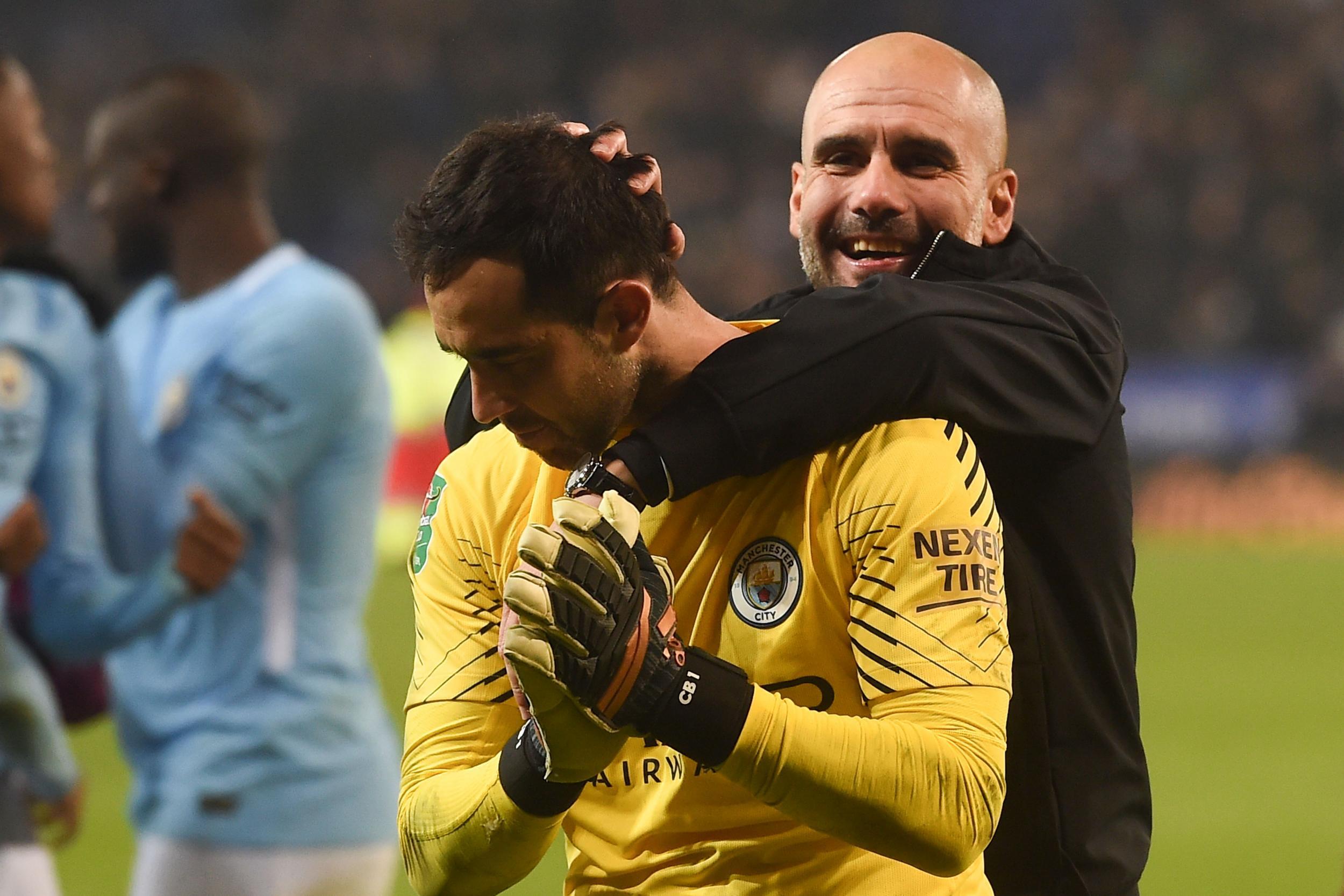 Pep Guardiola celebrates with penalty hero Claudio Bravo