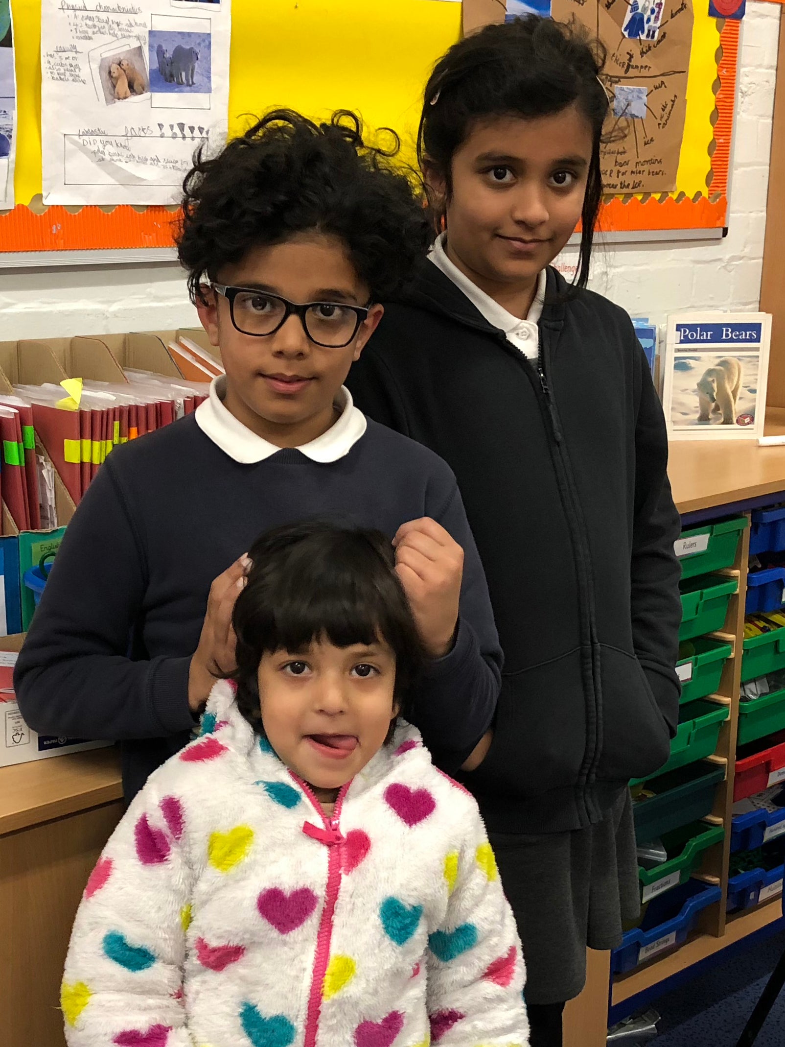 Zahra, 8, Mohammed, 7, and Aleeza, 3, are pupils at Hazel Community Primary School (Lucy Pasha-Robinson)