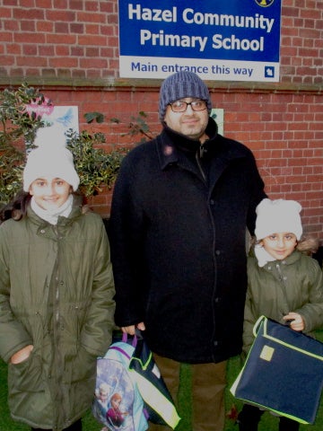 Khalid Iqbar with his daughters Marukh and Zahra