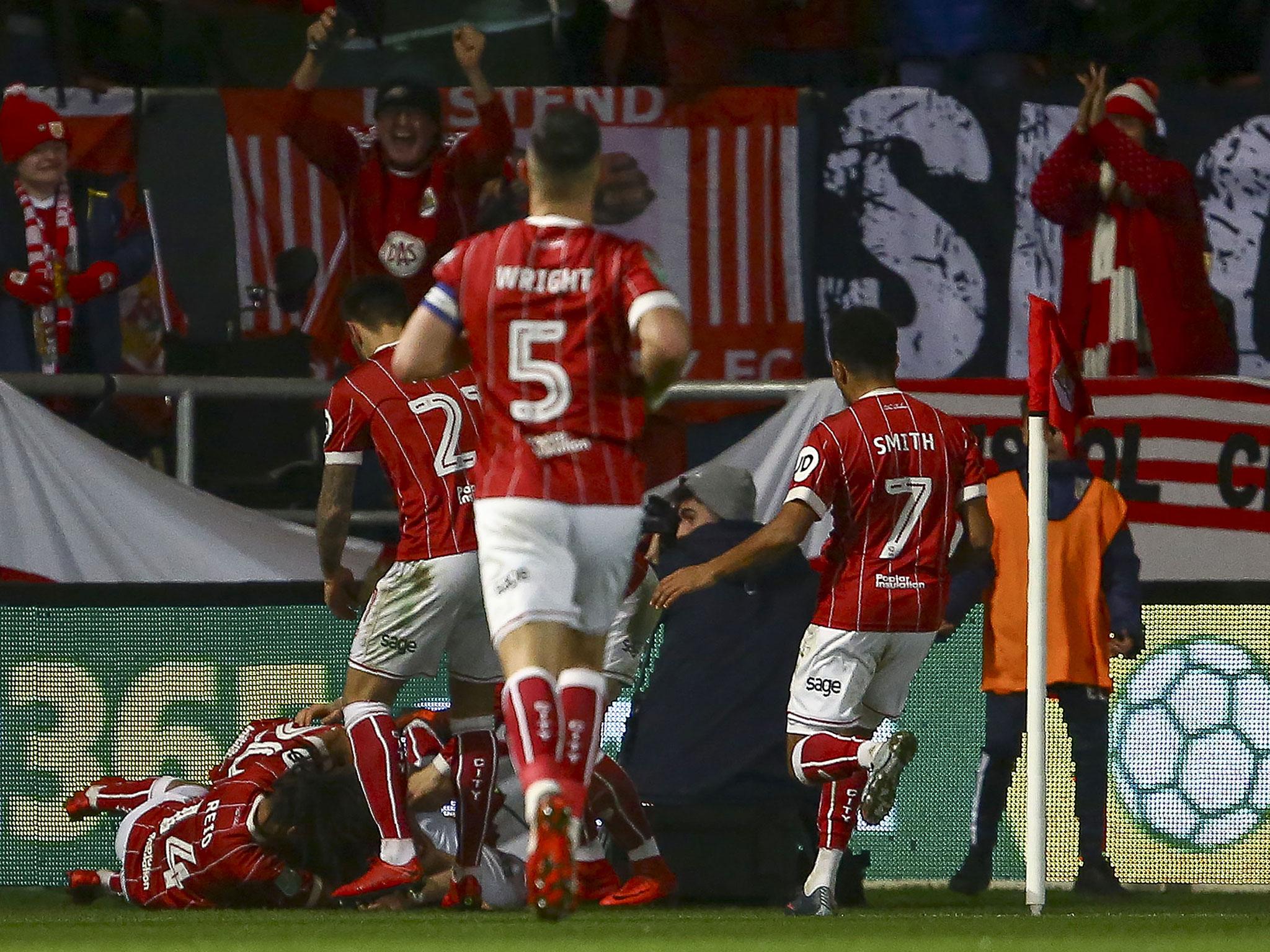 Bristol City's players celebrate after opening the scoring against United