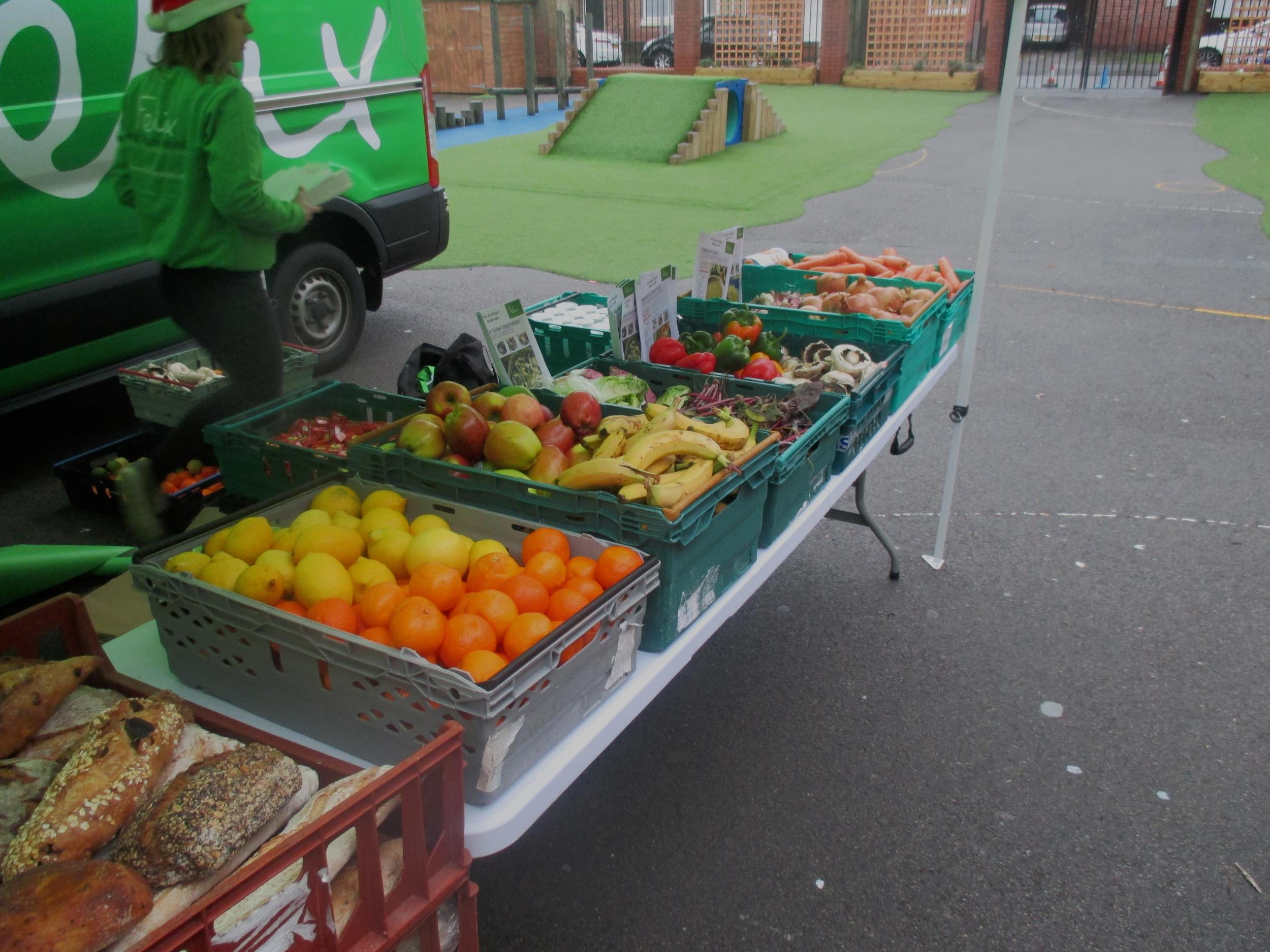 Fresh produce is laid out ahead of the end of school bell