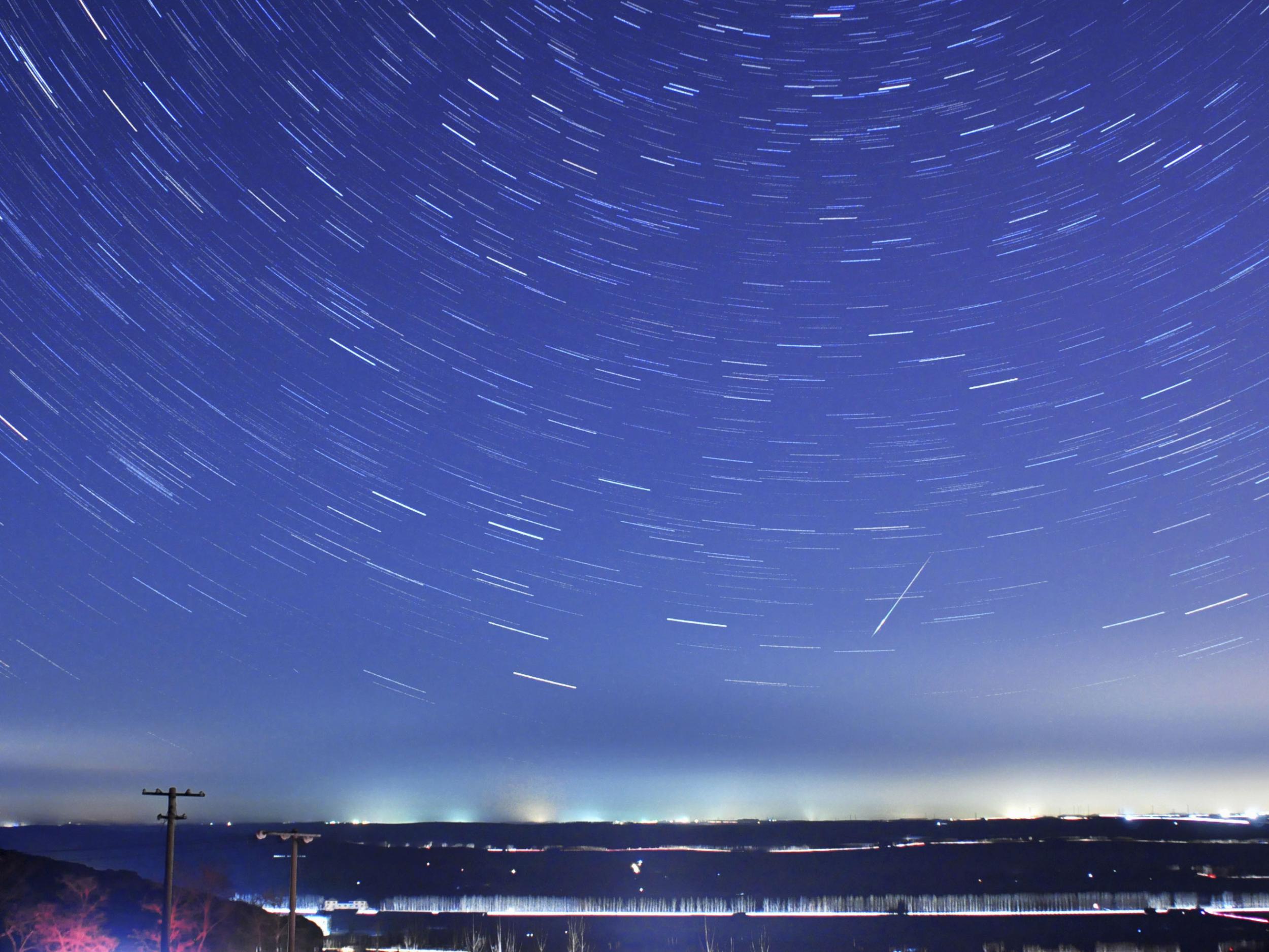 A meteor streaks past stars during the annual Quadrantid meteor shower in Qingdao, Shandong province, January 4.