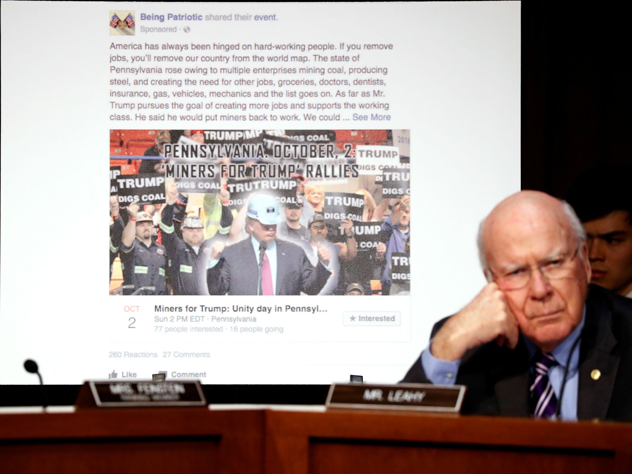 Senator Pat Leahy shows a fake social media as representatives of Twitter, Facebook and Google testify before Congress (Reuters)