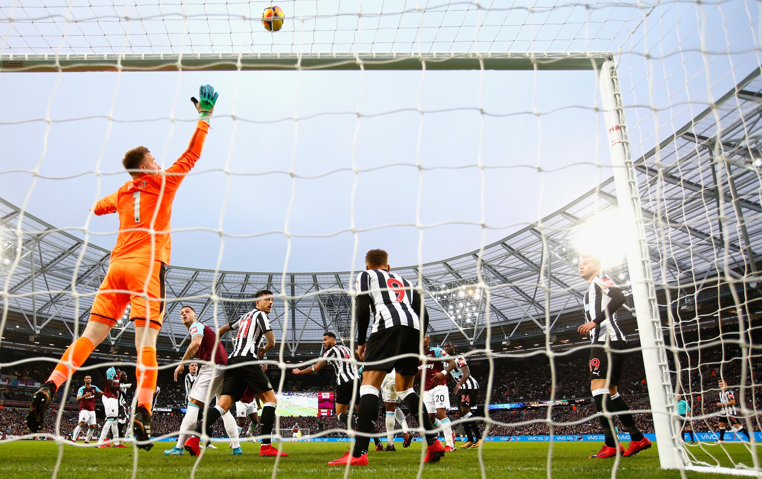 Joe Hart watches on as a Newcastle free-kick sails over