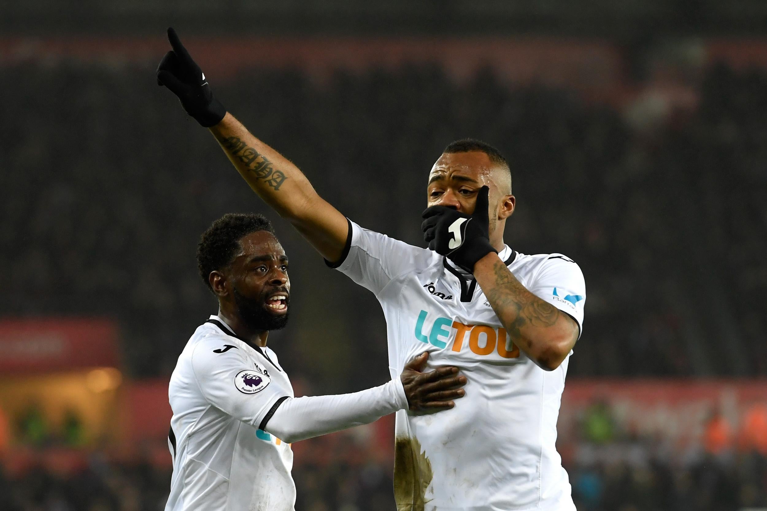 Jordan Ayew celebrates his equaliser for Swansea