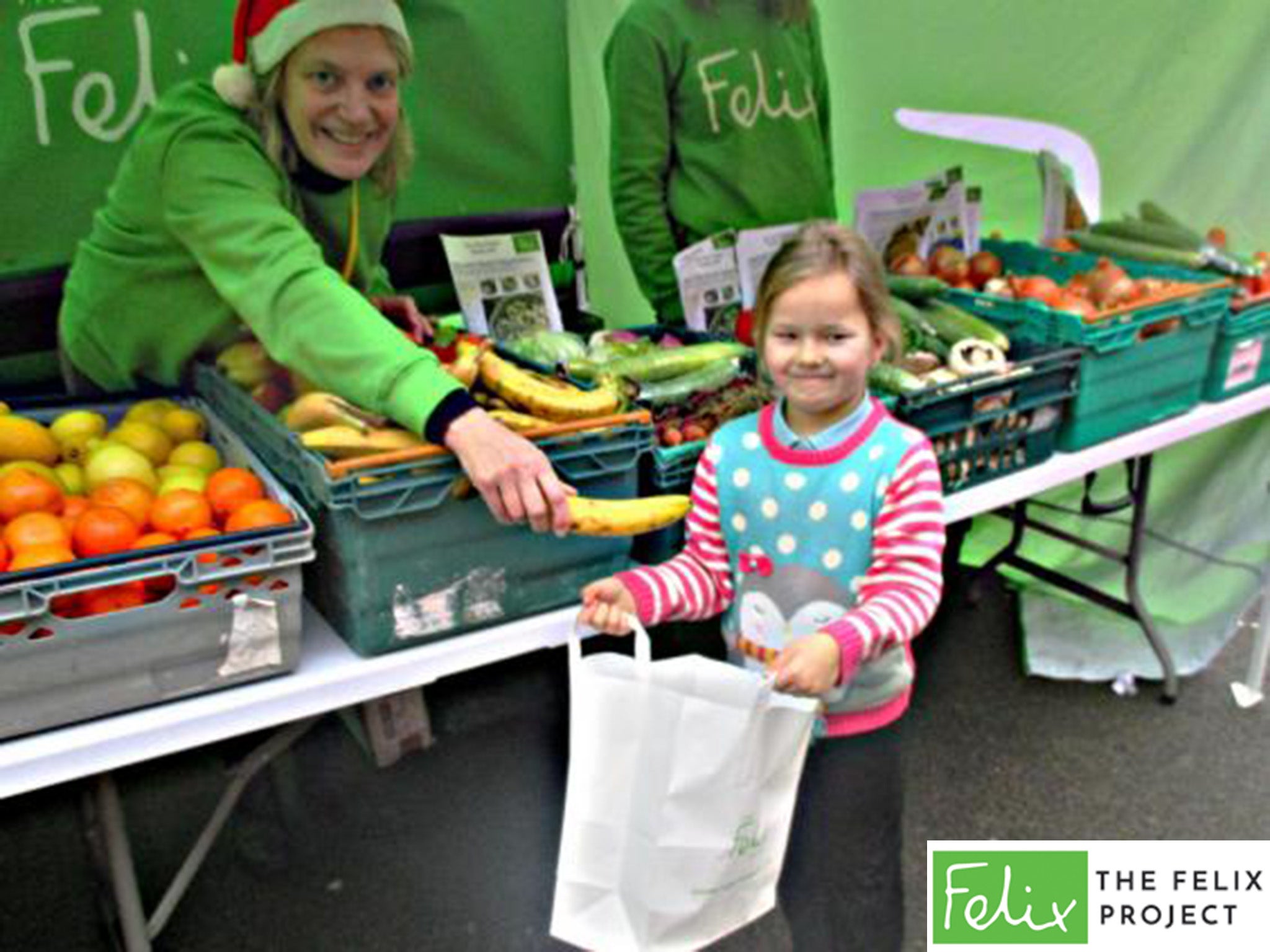 Six-year-old Summer loads up on fruit and vegetables for the school holidays thanks to The Felix Project