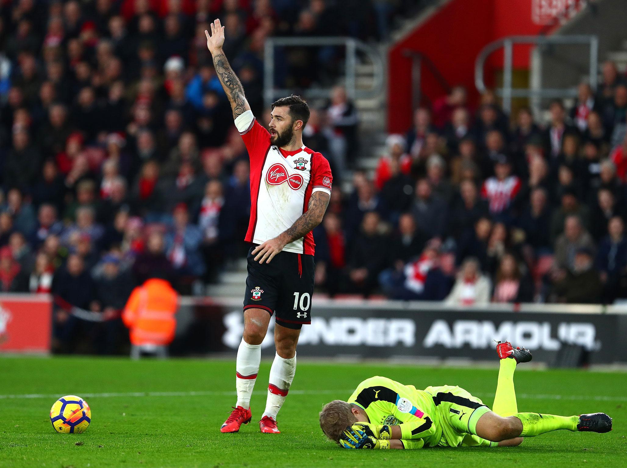 Charlie Austin could face FA action after an ugly clash with Huddersfield keeper Jonas Lossl