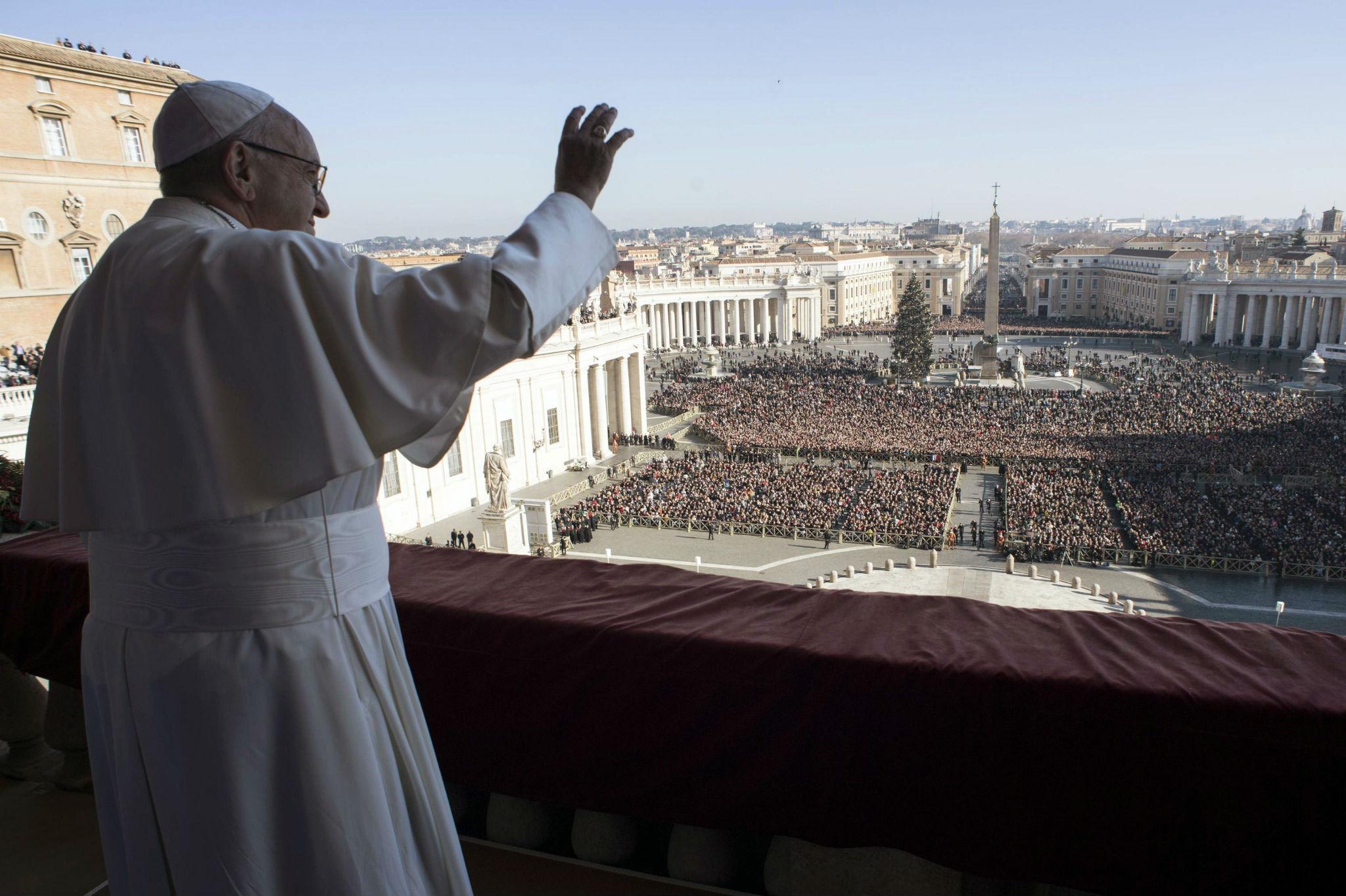 Pope Francis gives the Christmas Day blessing from St Peter’s Basilica at the Vatican