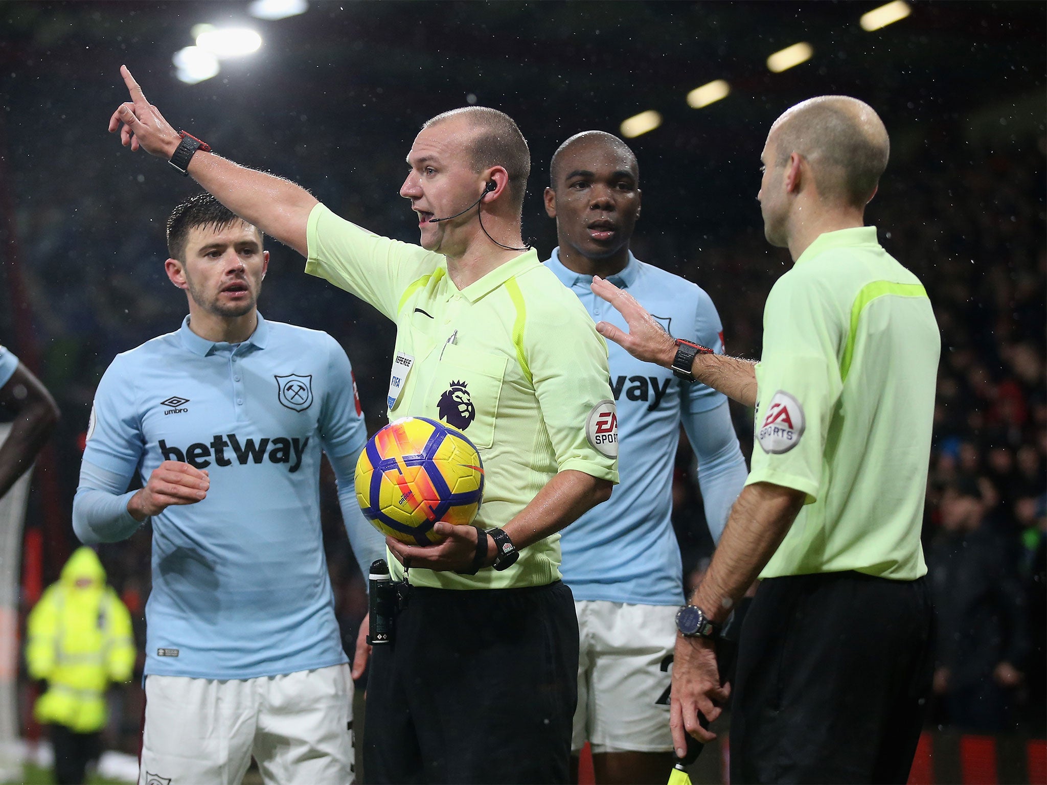 Stuart Attwell deals with West Ham protests after the late equaliser