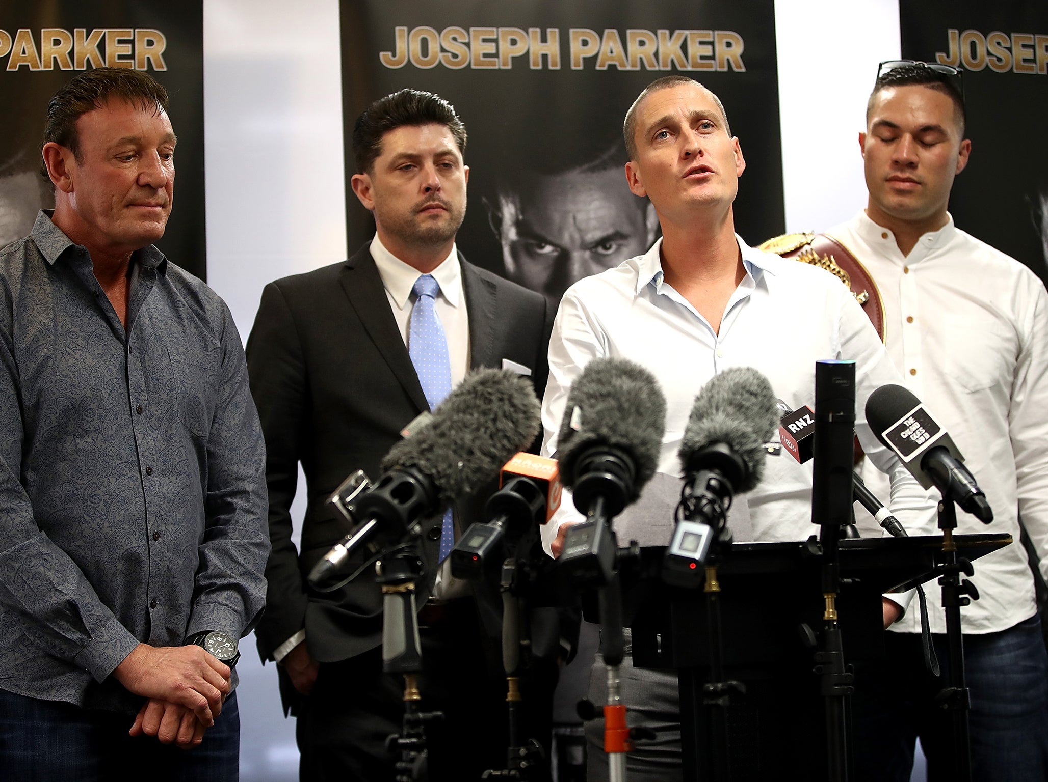 Parker's promoter David Higgins addresses a press conference