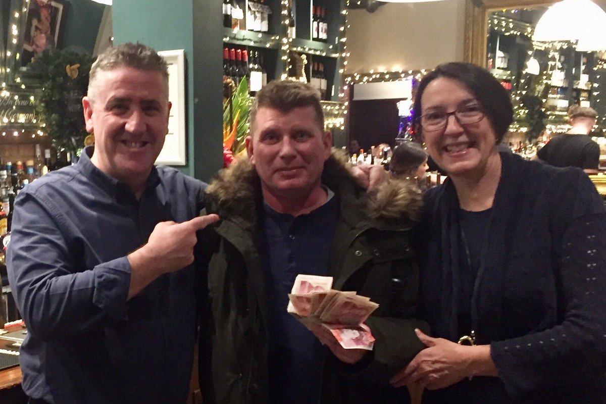 Mariusz (pictured centre) picked up his wages from the pub on December 27