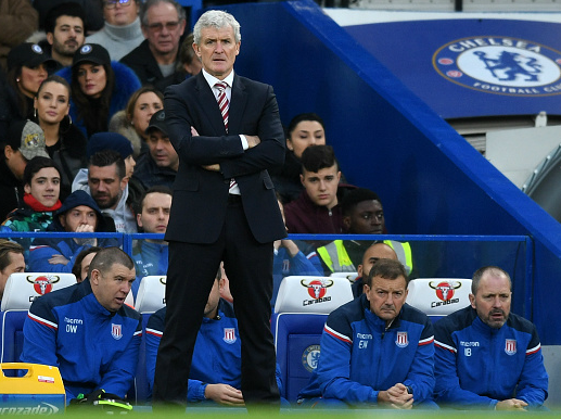 Mark Hughes watches on as his Stoke team struggle at Stamford Bridge