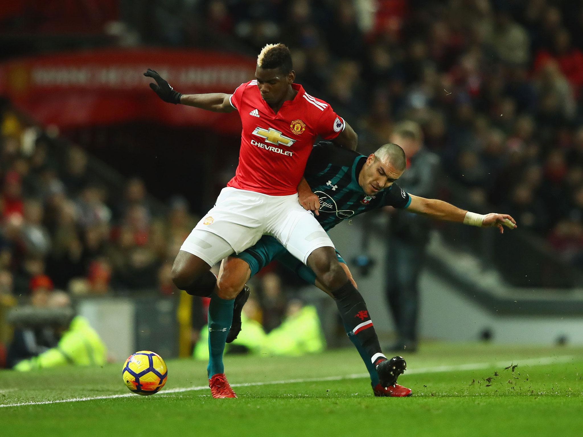 Paul Pogba attempts to hold on to possession