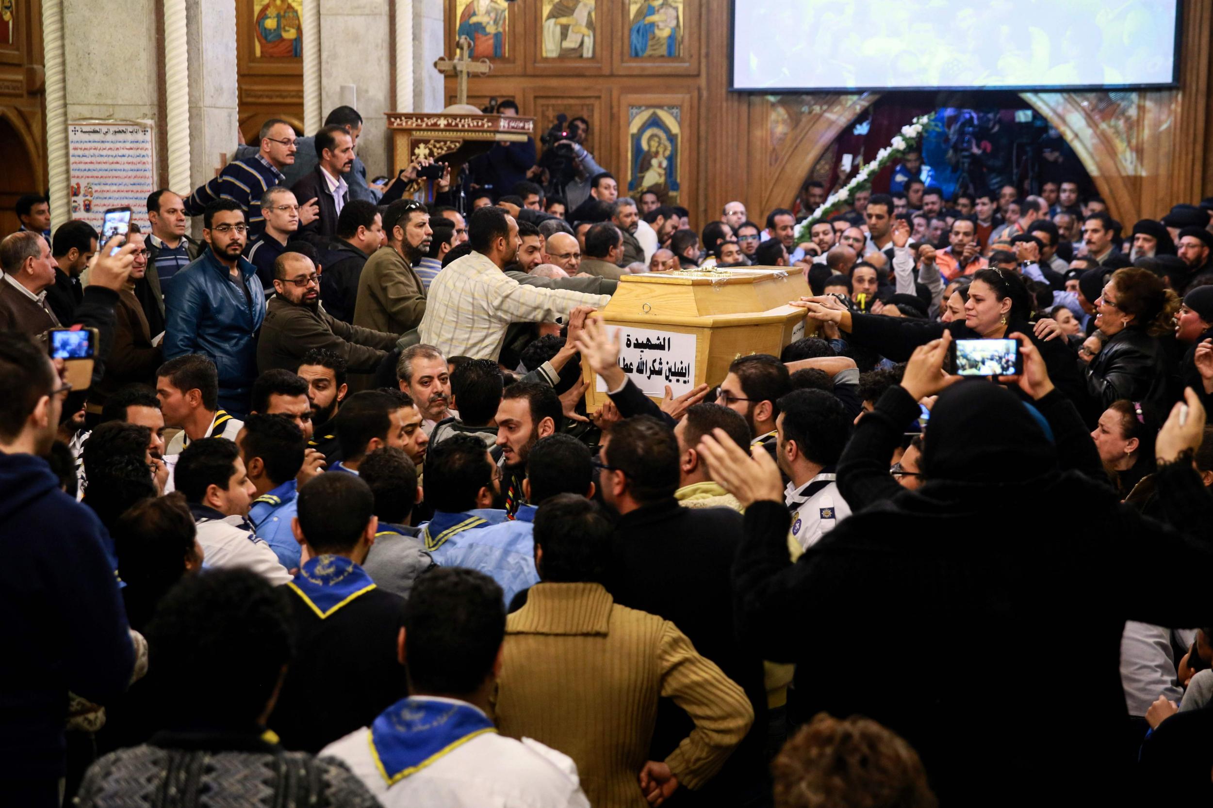 Egyptians gather for the funeral of the victims of the attack