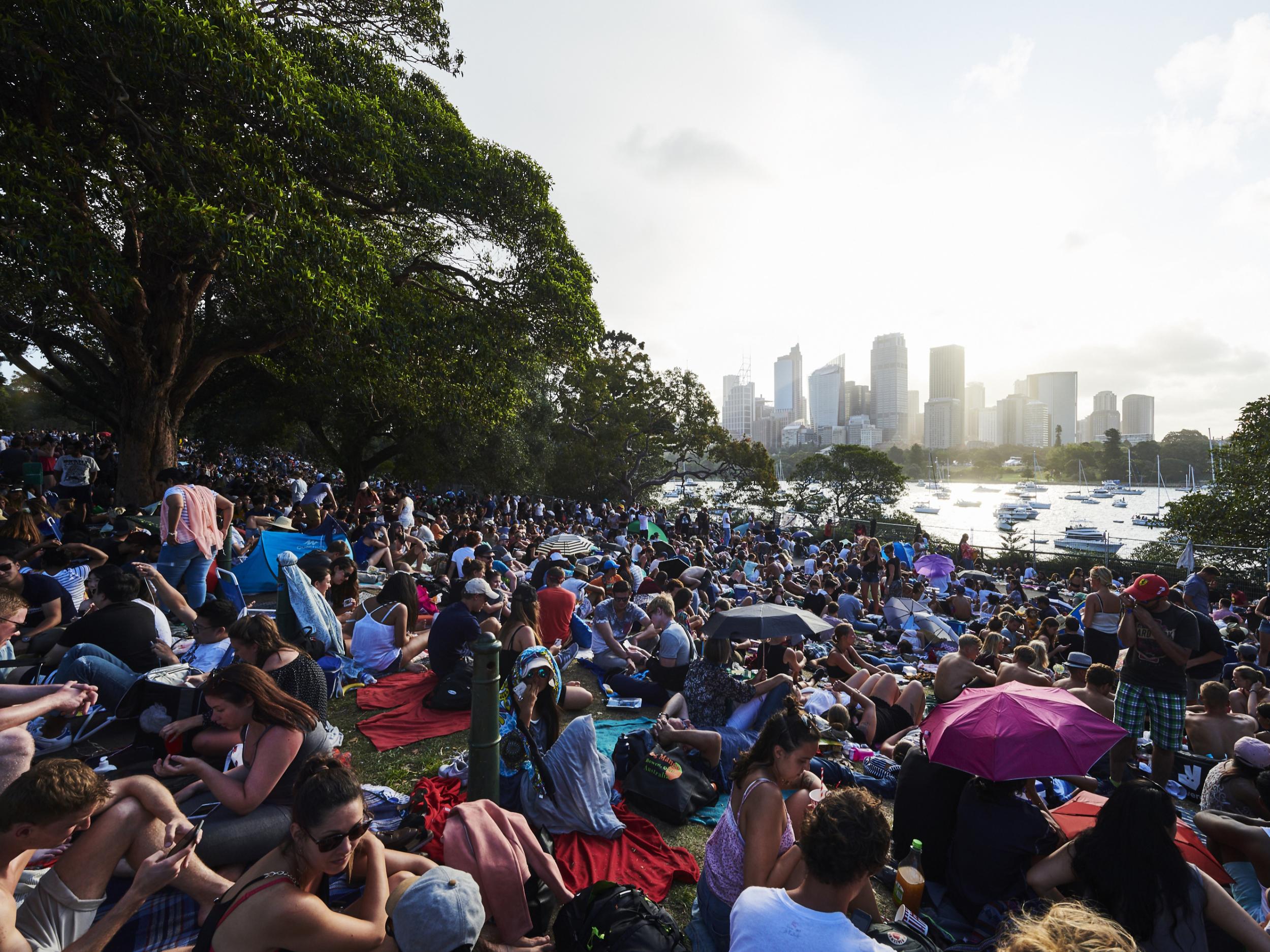 Crowd’s await the fireworks on New Year’s Eve on Sydney Harbour on December 31, 2017 in Sydney, Australia