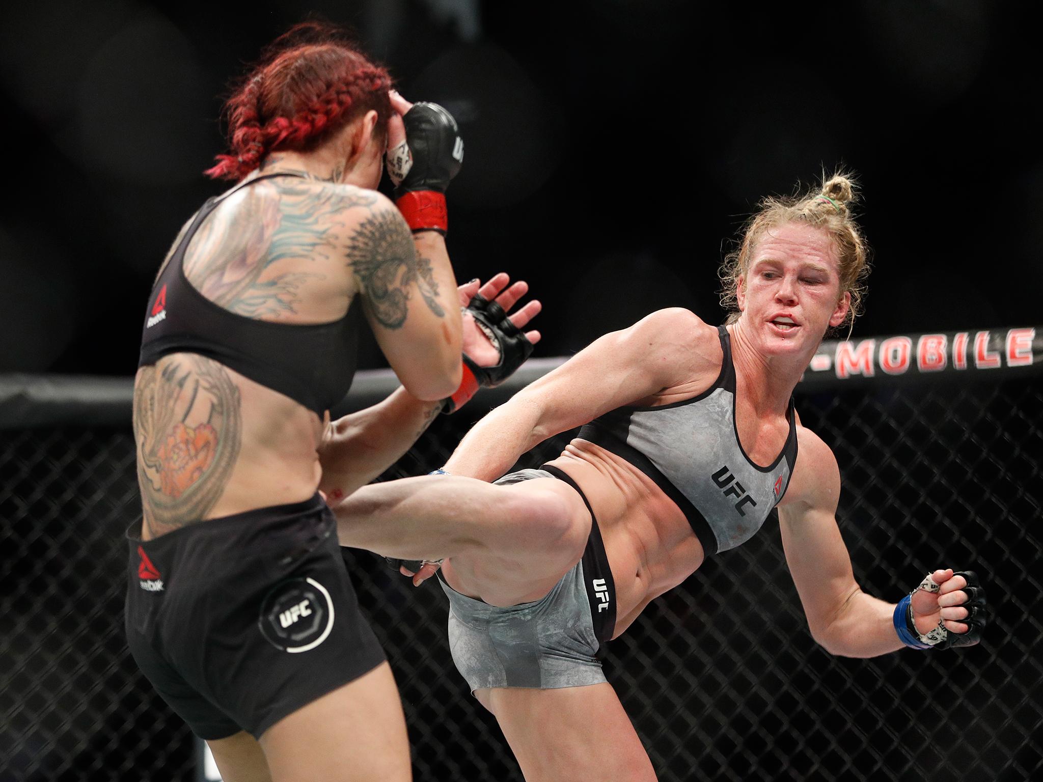 Holm attempted to gain success with a series of kicks to the head and body of Cyborg