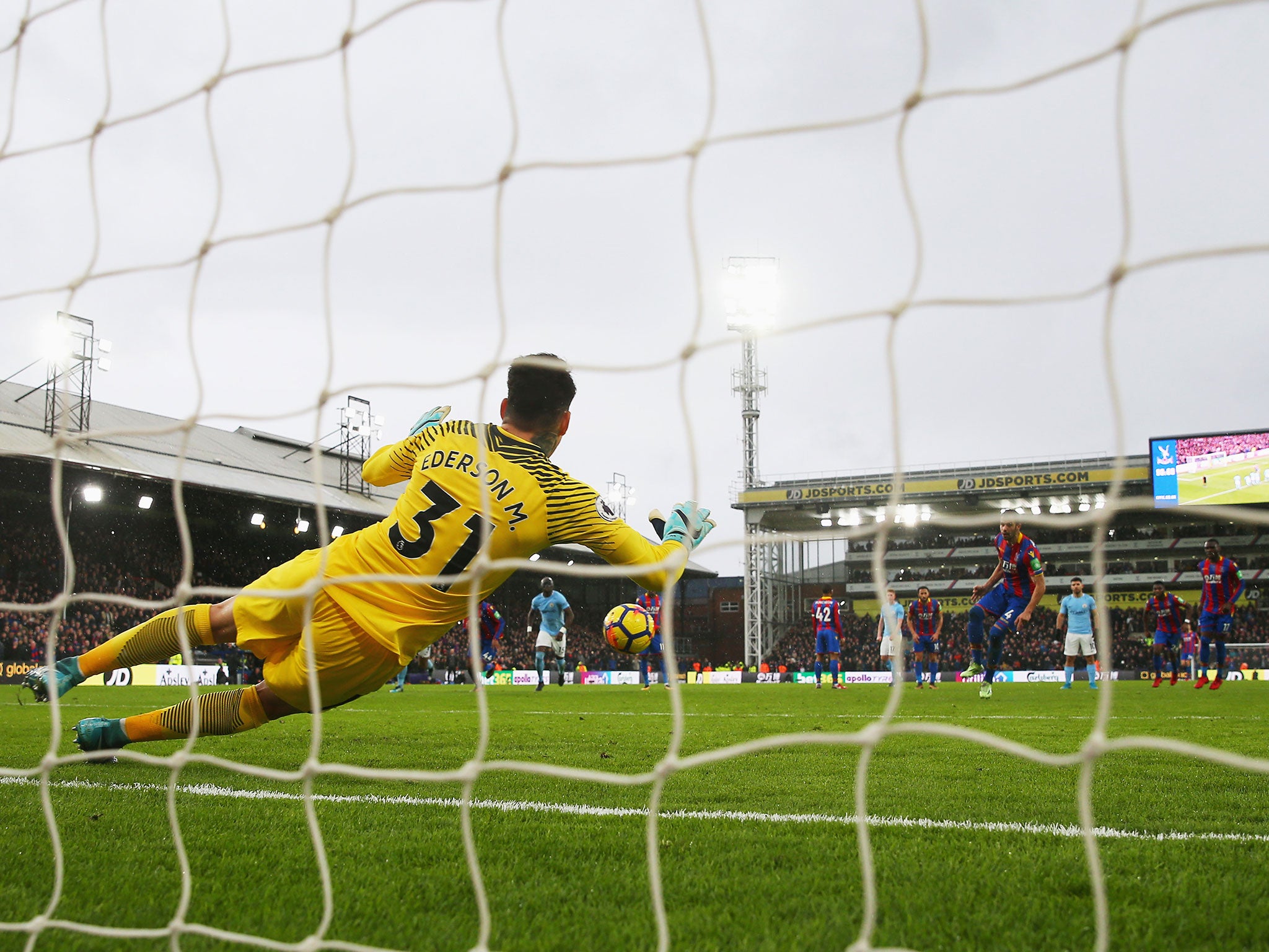 Ederson got down well to save Luka Milivojevic's late penalty