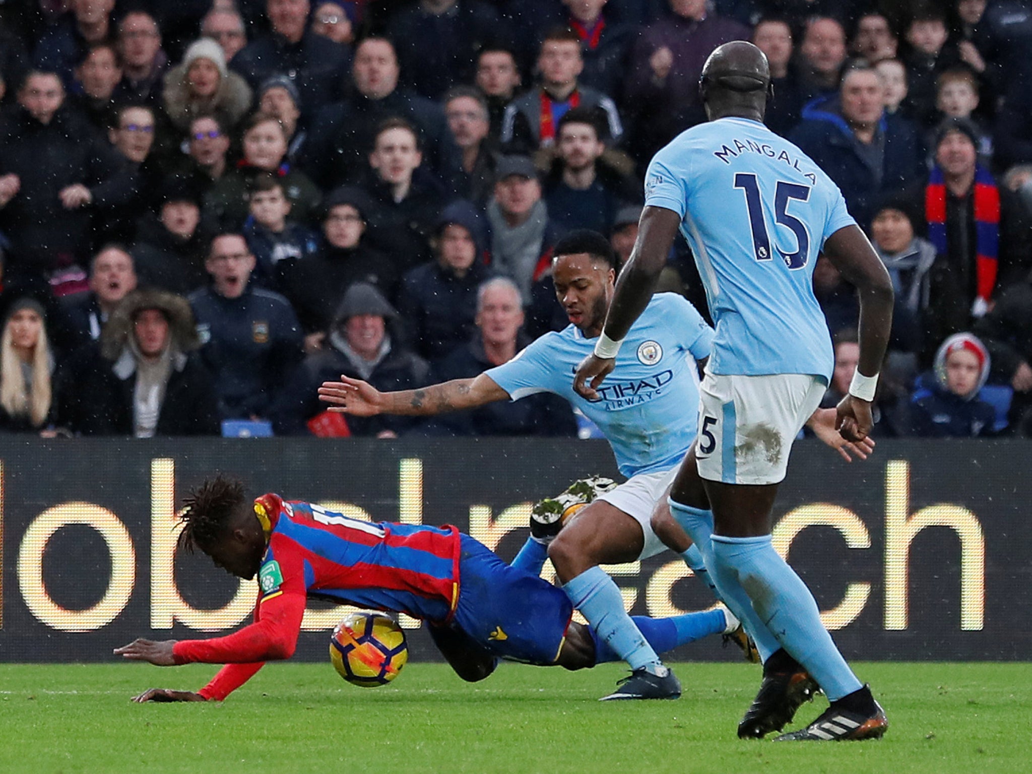 Wilfried Zaha won a penalty when he was brought down by Raheem Sterling