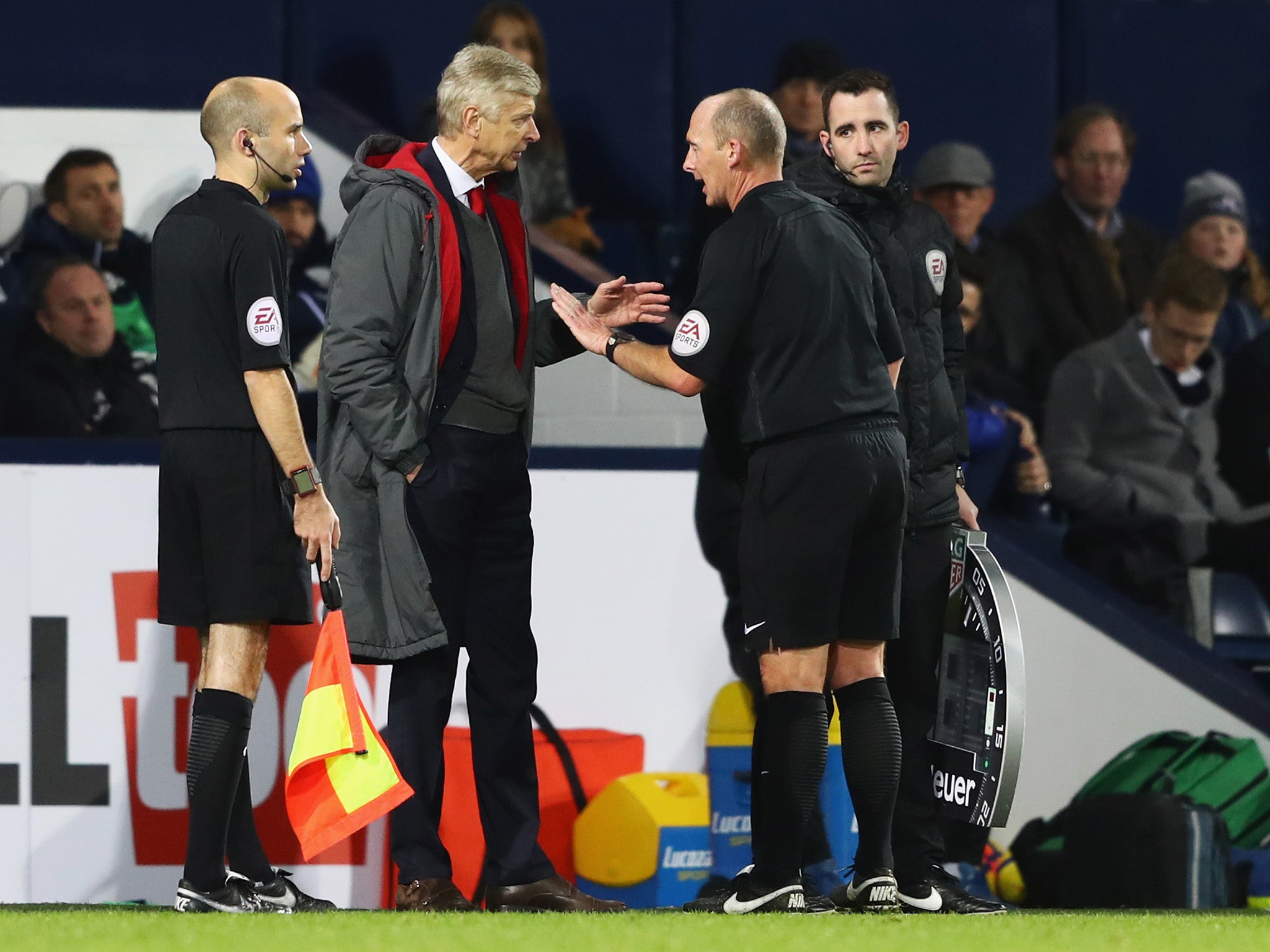 Arsene Wenger remonstrates with Mike Dean after West Brom's late penalty