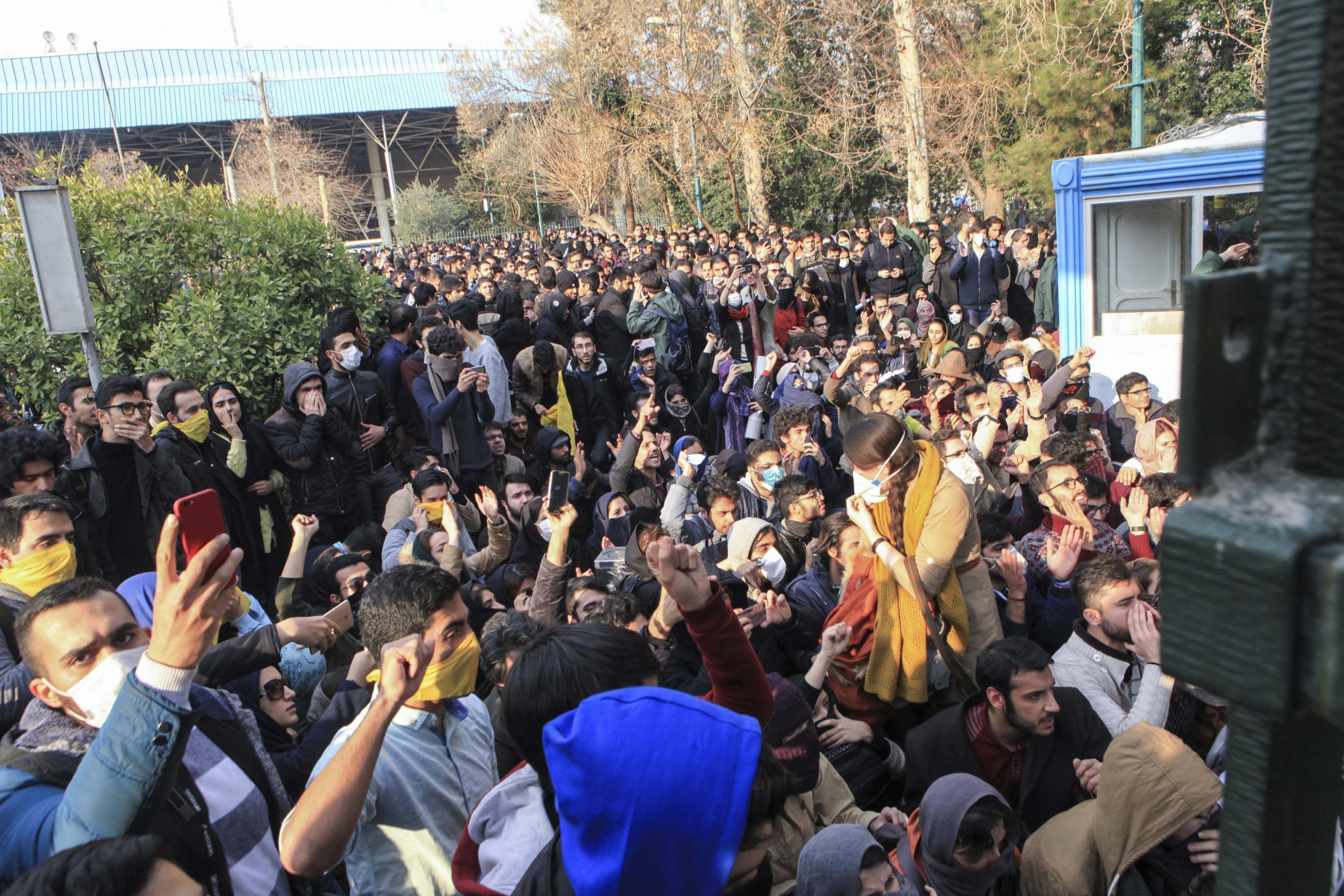 Students protest at Tehran University on Sunday, one of many gatherings that have spread rapidly through the country