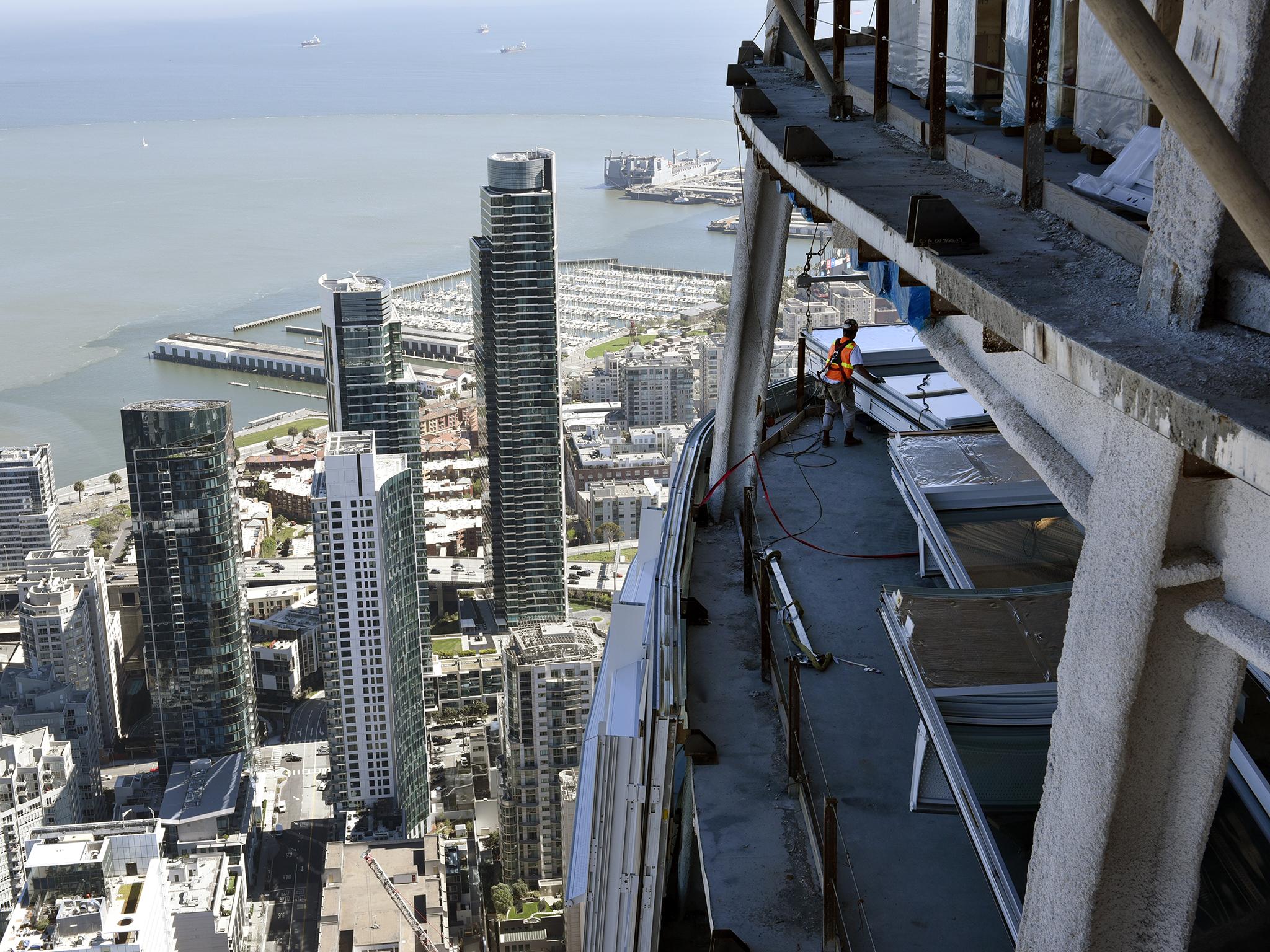 Its 61 storeys of tapered steel and glass stick up like a forceful thumb