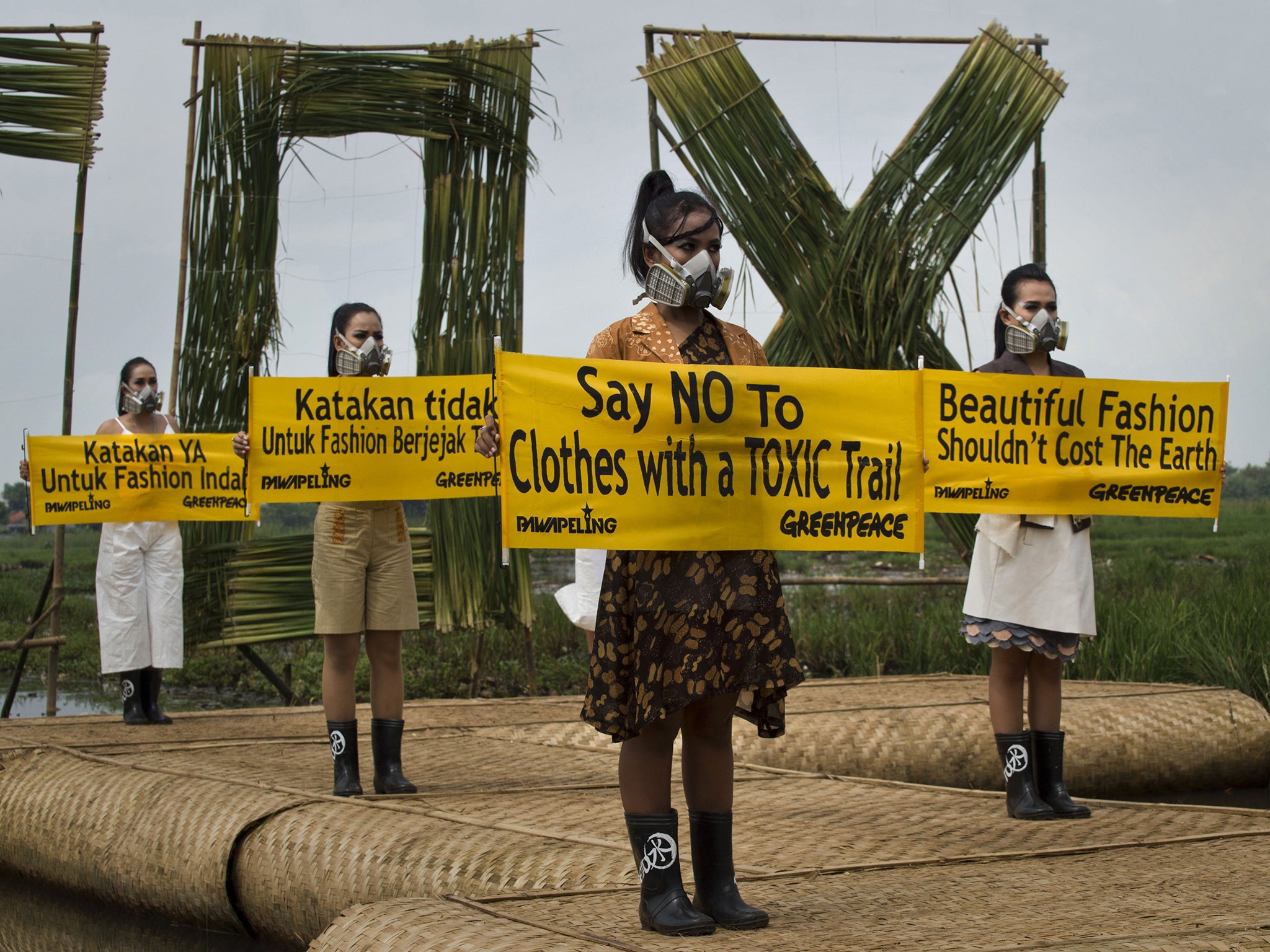 Models with gas masks – part of a Greenpeace campaign for top fashion brands to remove toxic chemicals from their supply chains in Indonesia