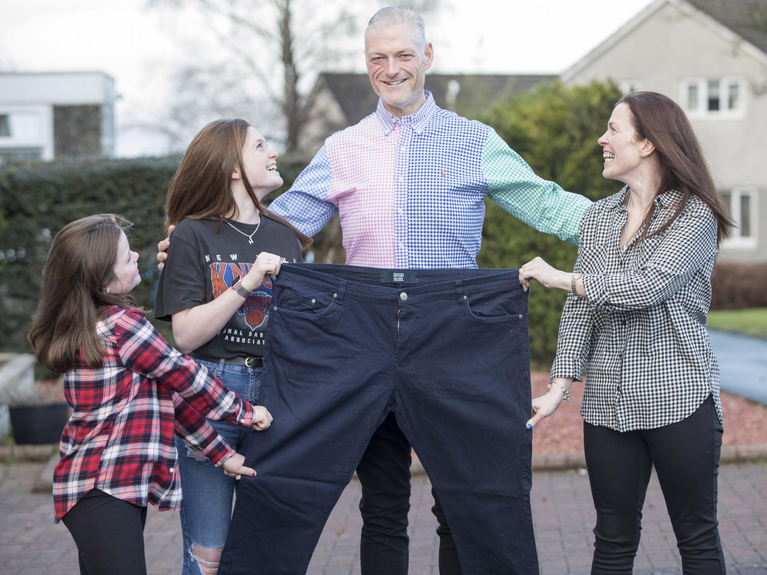 Adam Moffat with his wife Margaret and daughters Hannah, 13, and Holly, nine