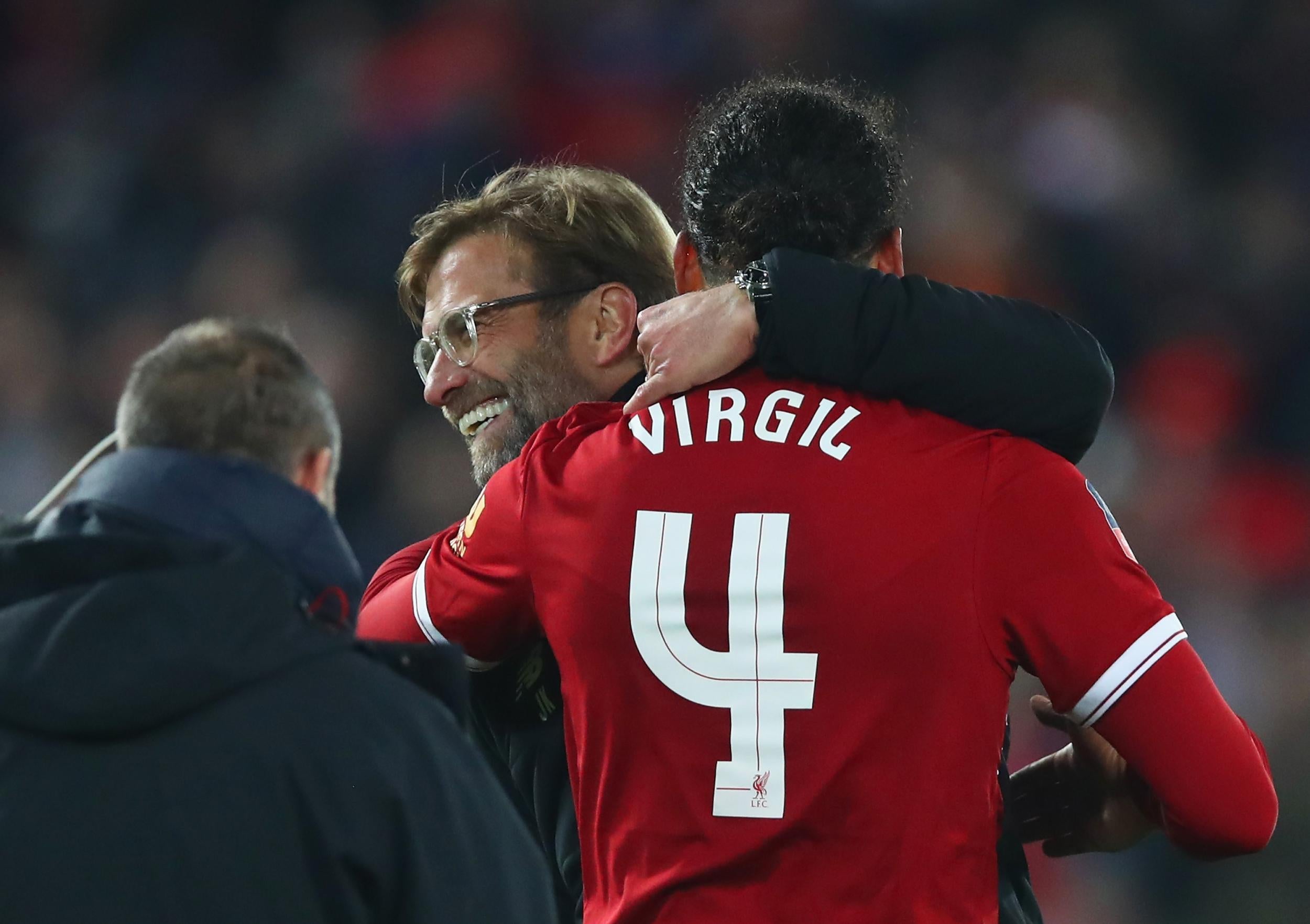 Virgil van Dijk and Jurgen Klopp embrace after the final whistle