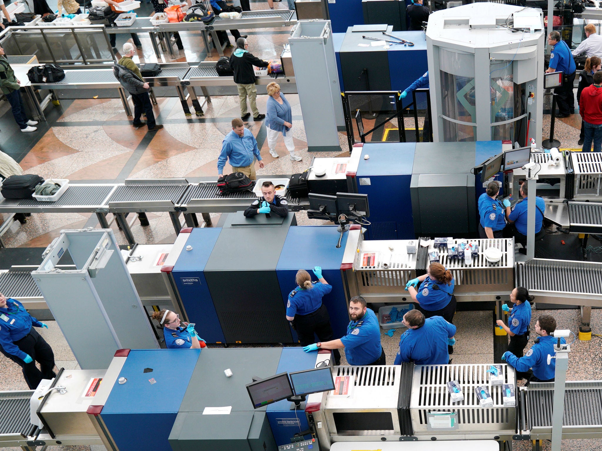TSA Security personnel wait for passengers at Denver International Airport