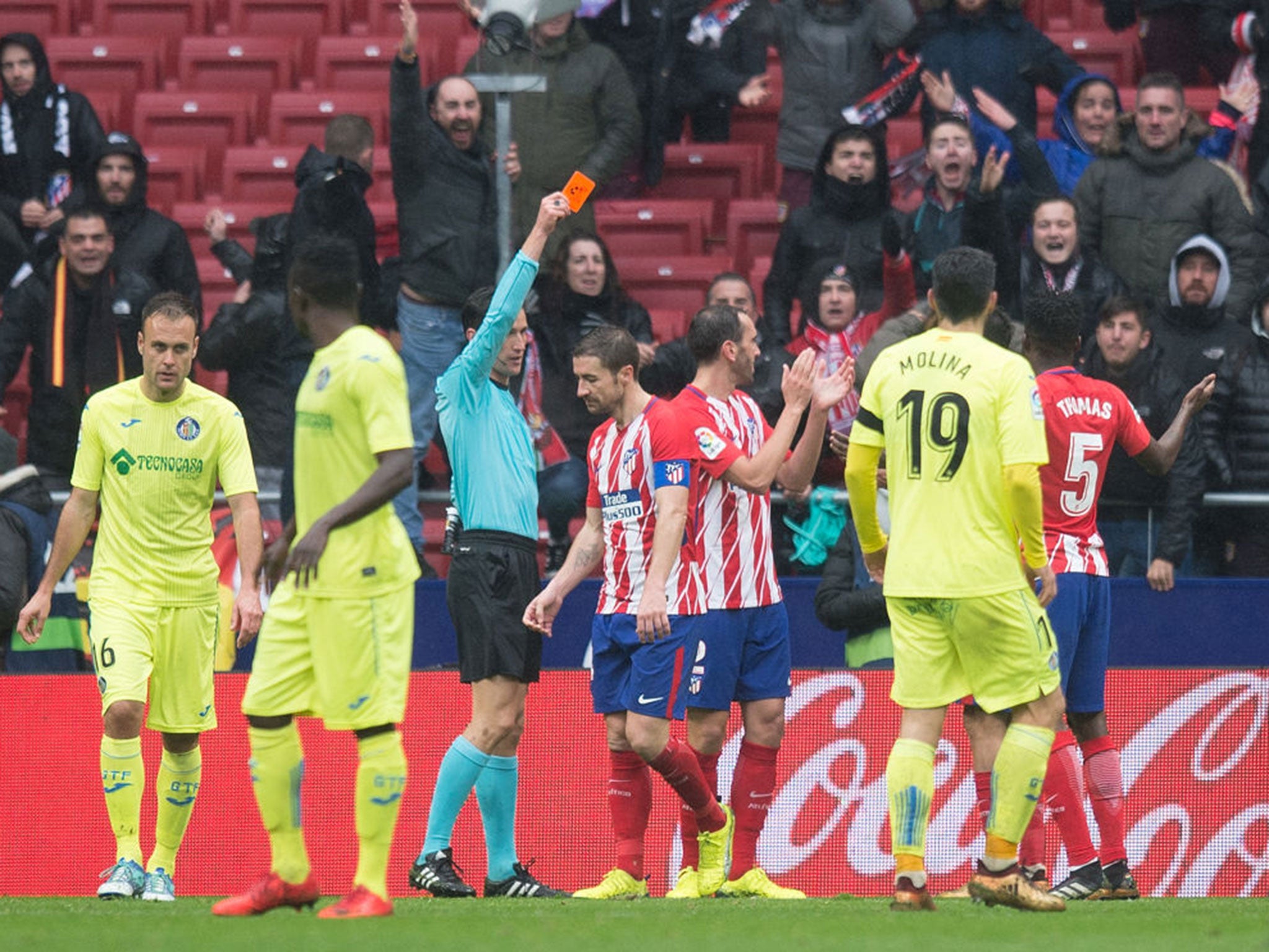 &#13;
Having already been booked, he is then sent off by referee Jose Munuera (Getty )&#13;