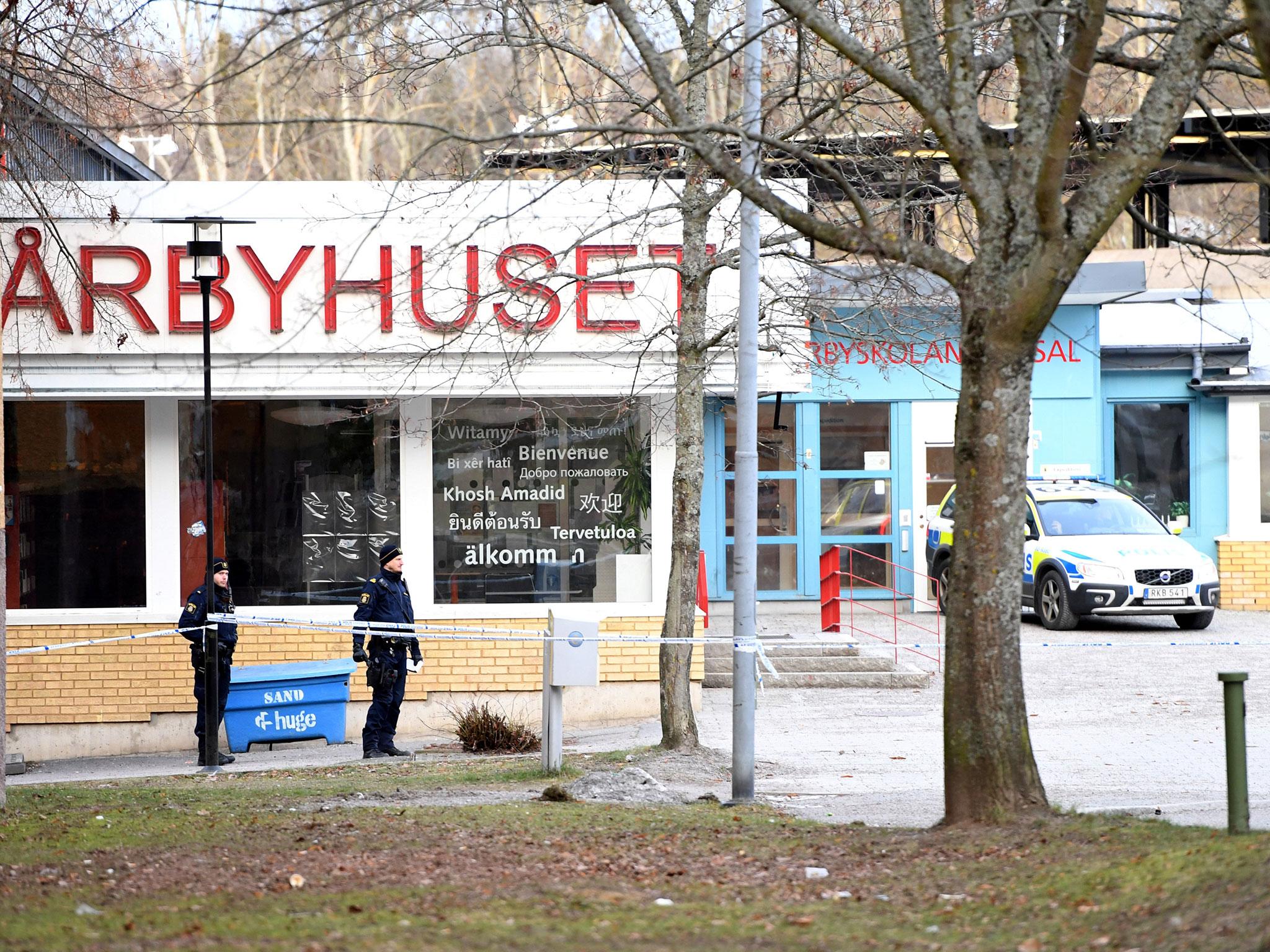 Police officers cordon off the area outside Varby Gard metro station (TT News Agency/Henrik Montgomery/via Reuters)