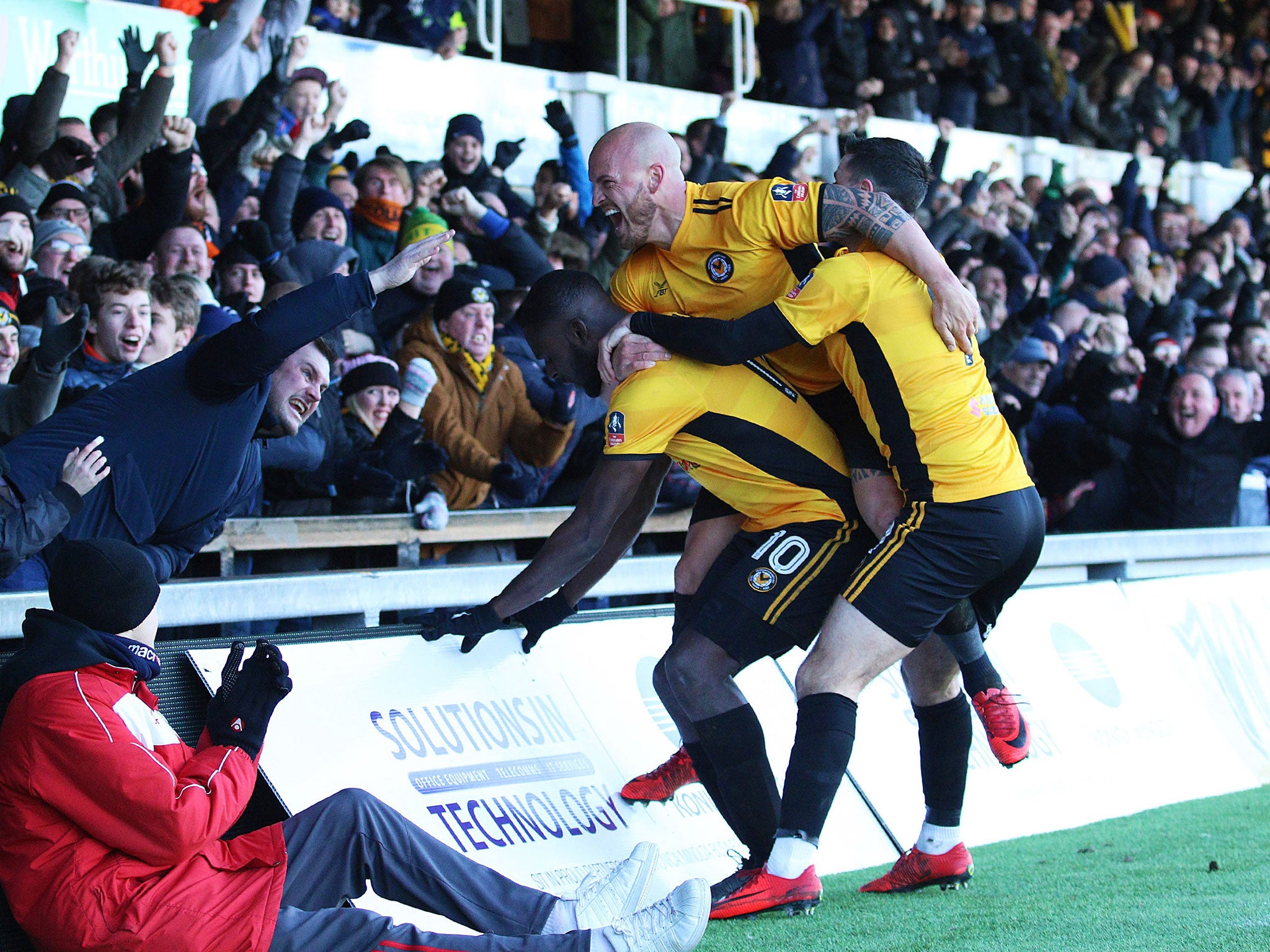 &#13;
David Pipe and Padraig Amond join Frank Nouble as he celebrates his side's equaliser &#13;