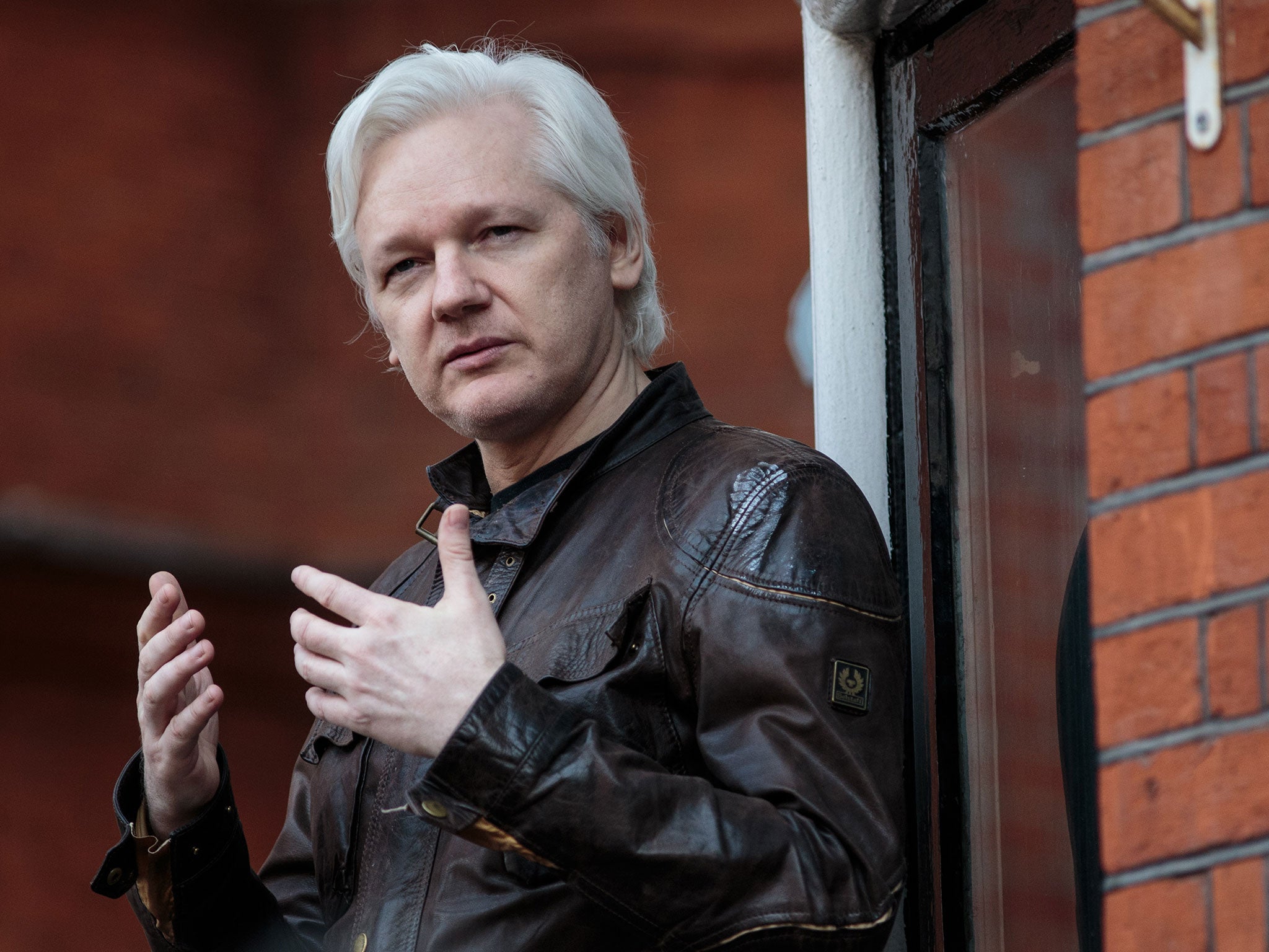 Julian Assange, the founder of WikiLeaks, speaks to the media from the balcony of Ecuador's embassy in London