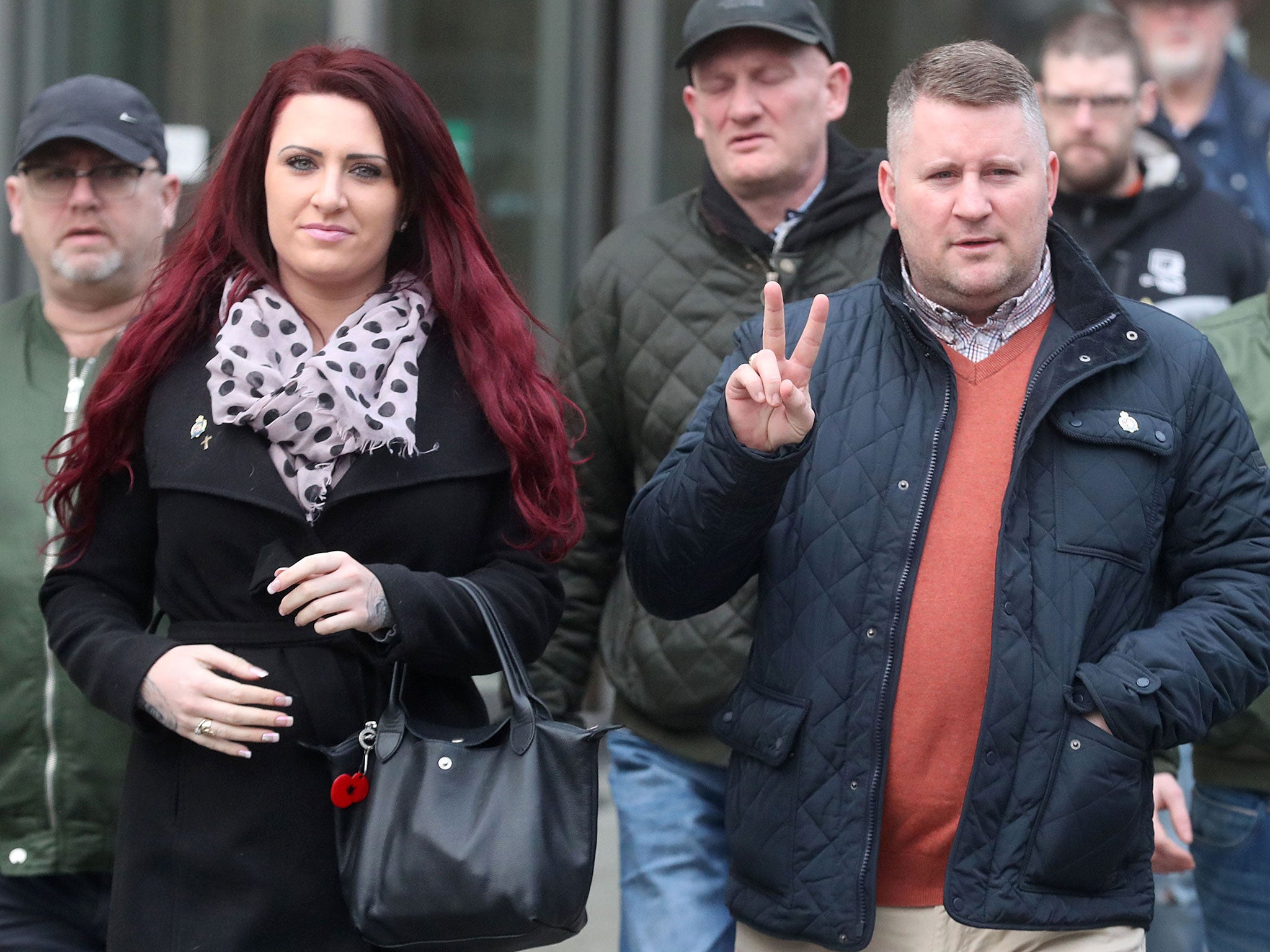 Britain First leader Paul Golding leaves Belfast Magisrates' Court alongside Jayda Fransen and supporters after a hearing on 10 January