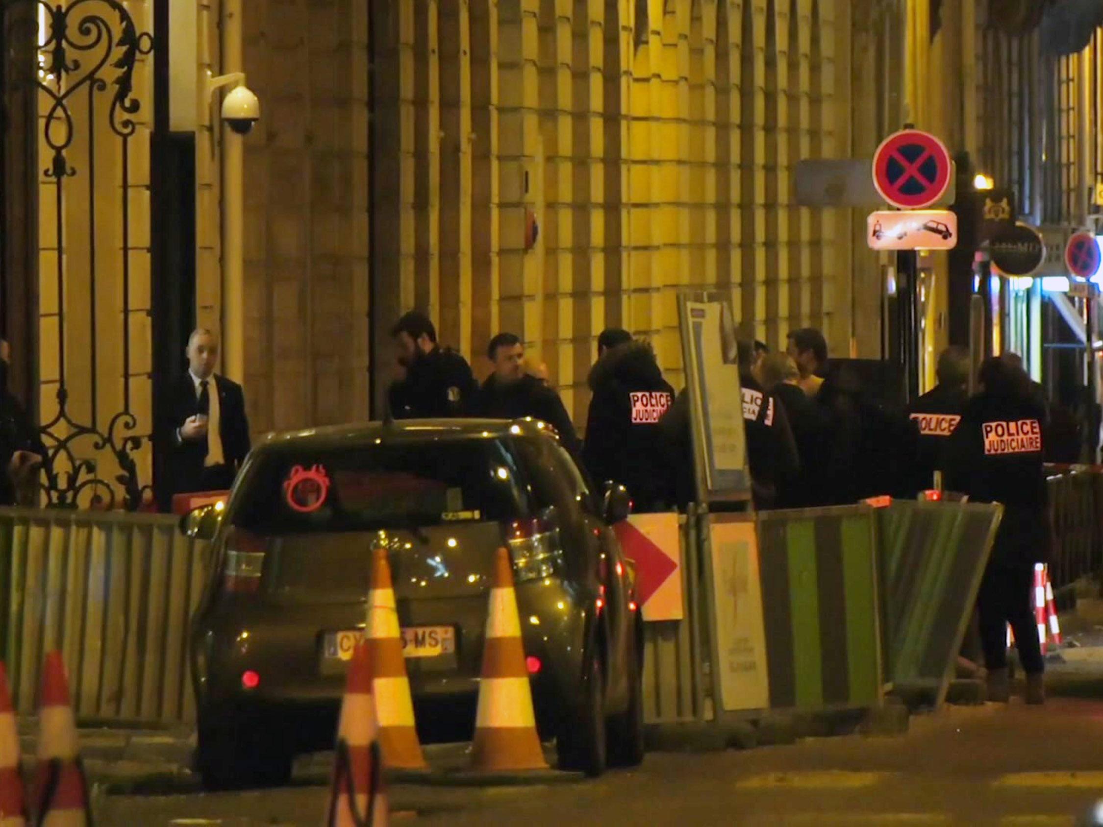 French police attend the scene outside the Ritz Hotel in Paris after a robbery on Wednesday evening