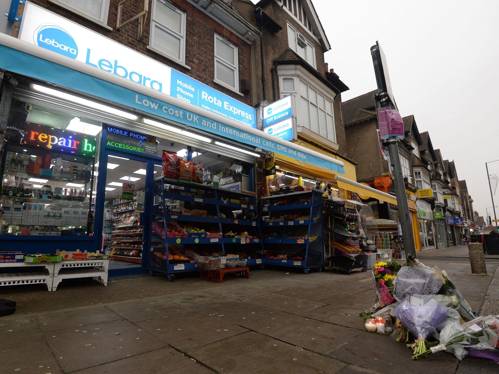 Tributes to Vijay Patel outside the Rota Express shop on The Broadway in Mill Hill, north London