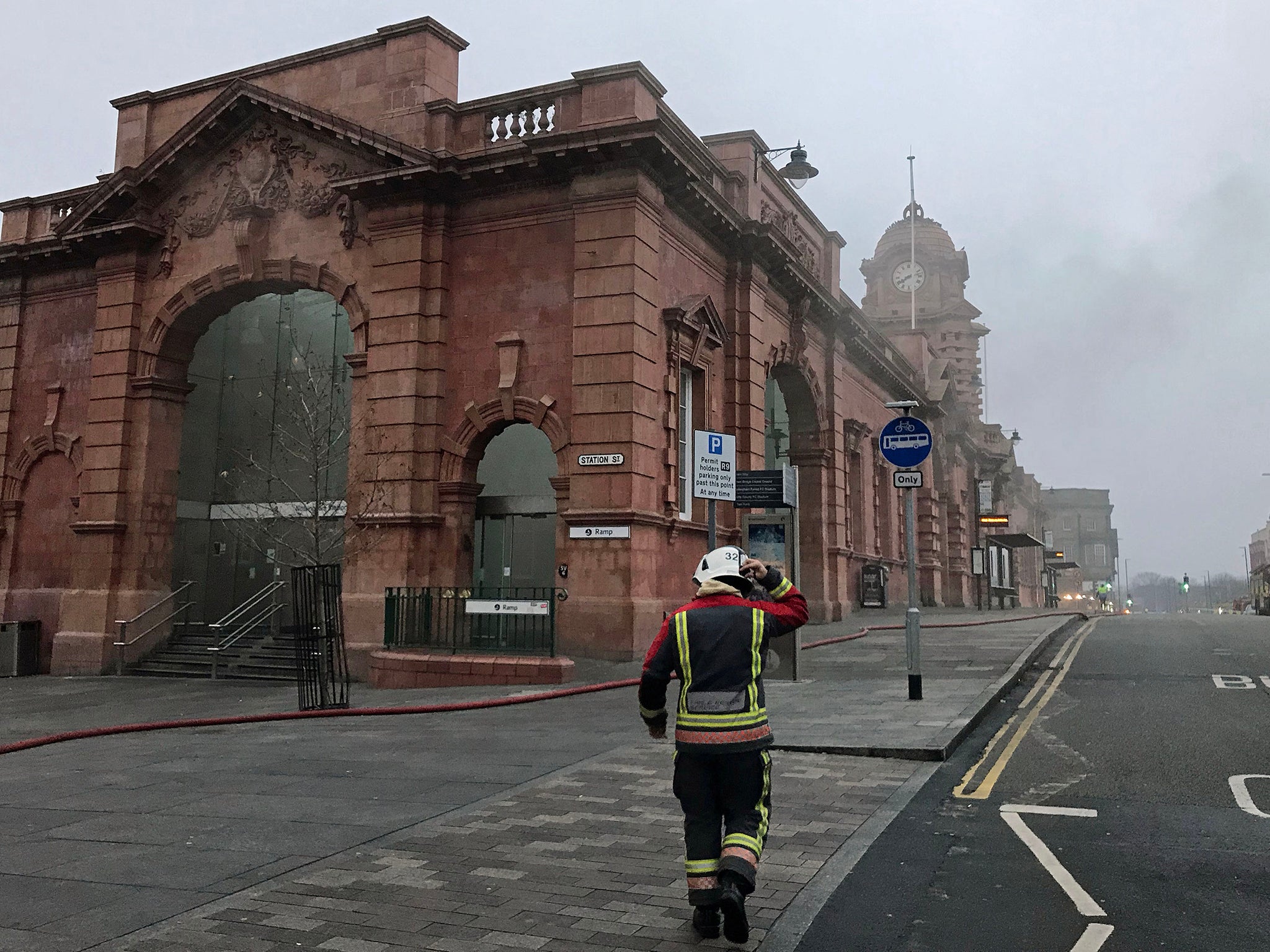 A firefighter walks towards the station during the blaze in January 2018