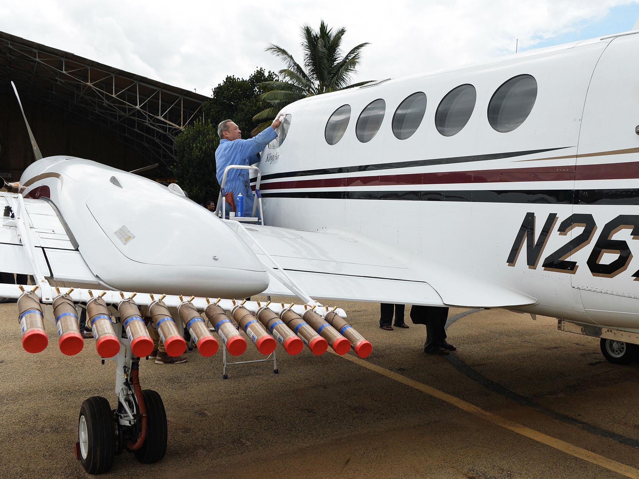 Up, up and away: Aeroplanes are used to drop the substances onto the clouds (AFP/Getty)