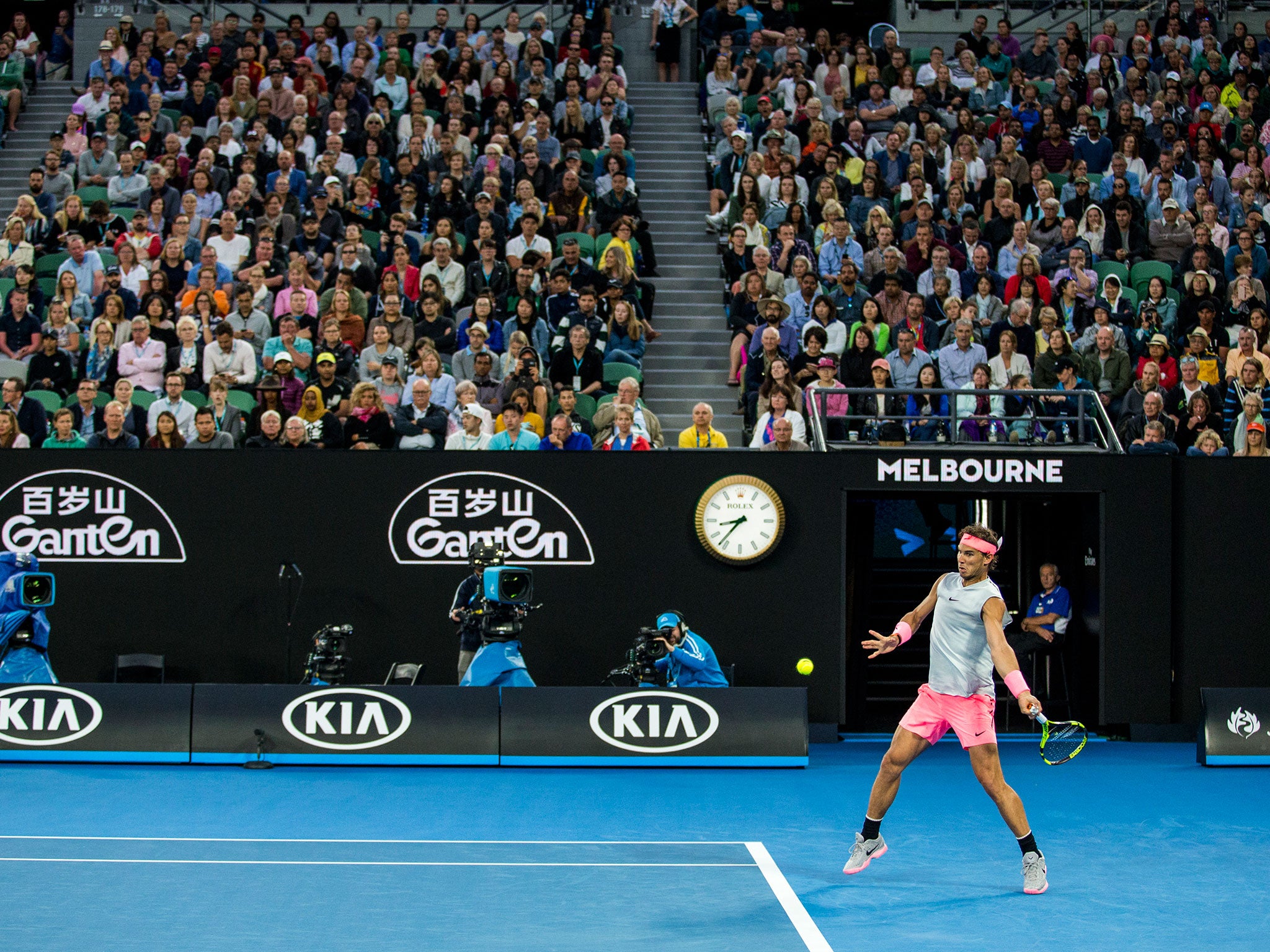 Rafa Nadal plays a baseline shot against Victor Estrella Burgos