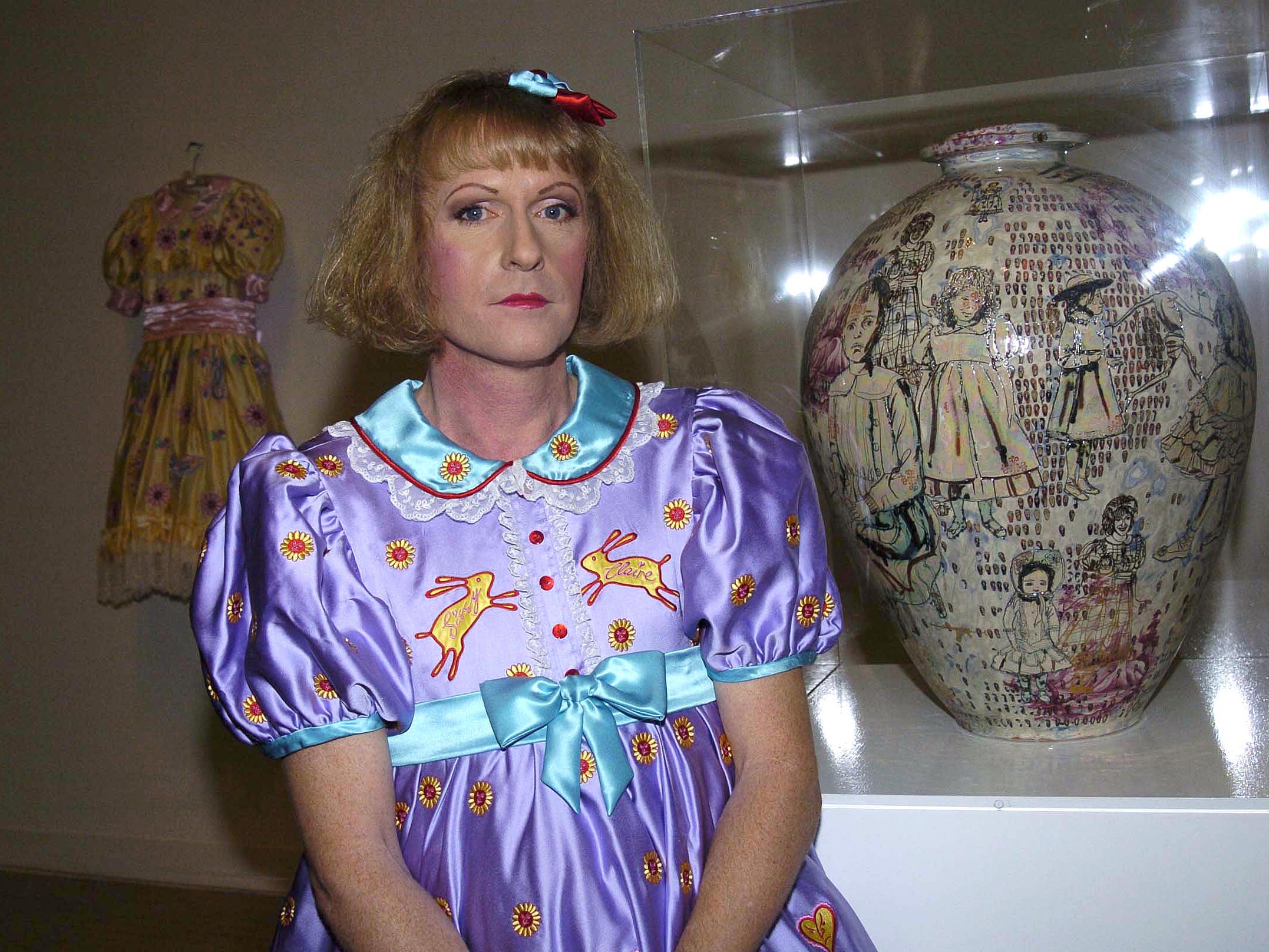 Grayson Perry with his work