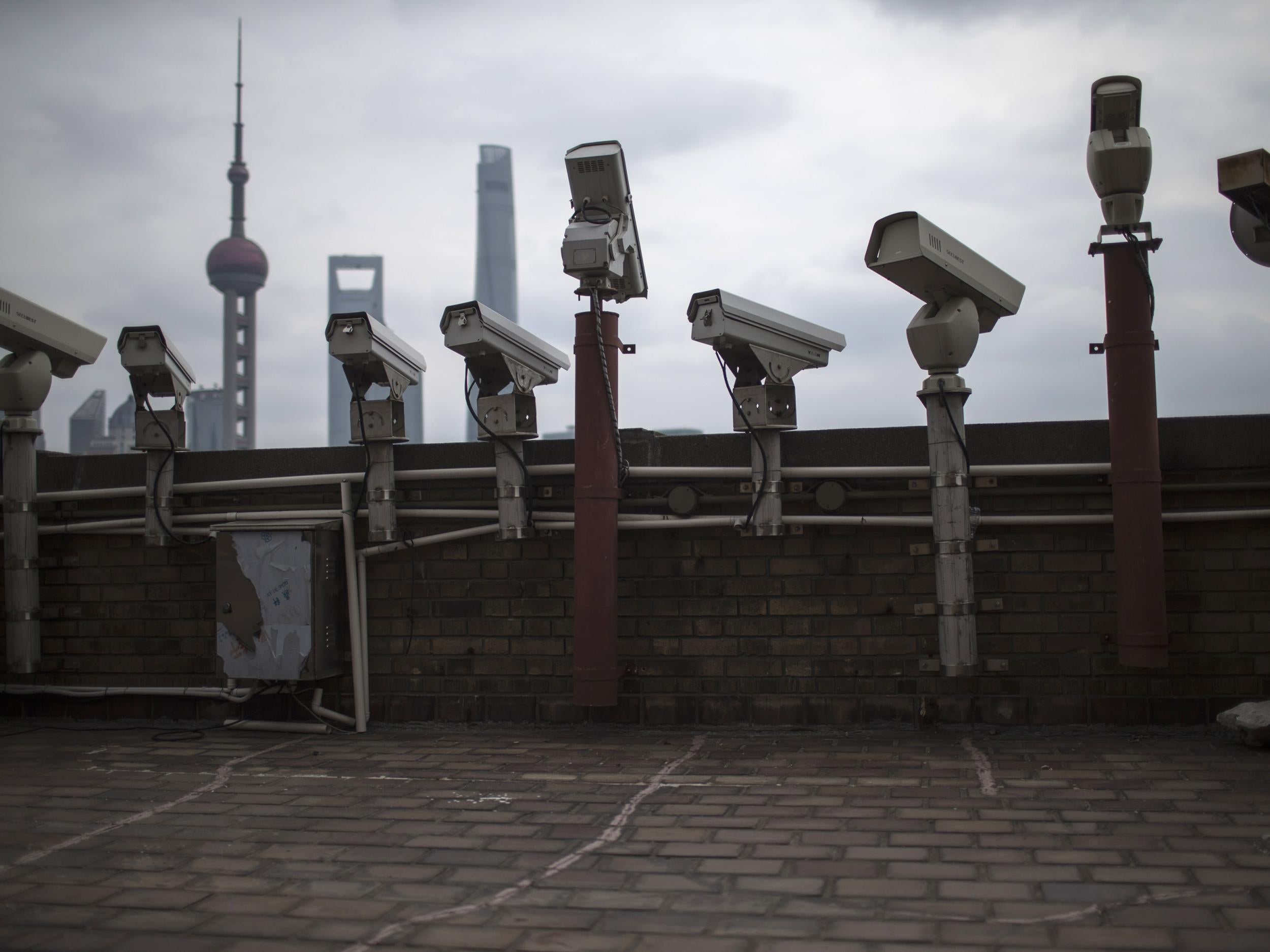 Security cameras are seen on a building in Shanghai