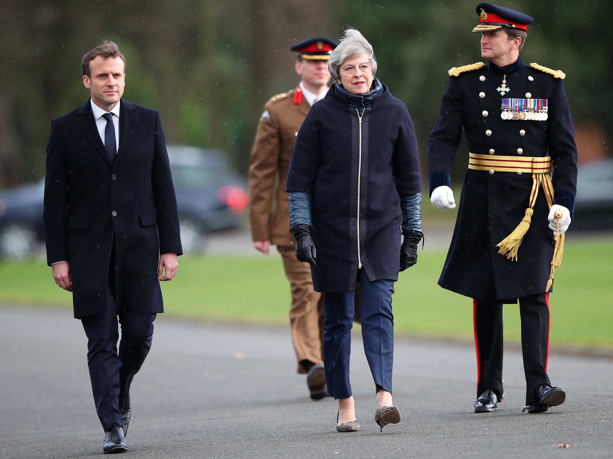 France's President Emmanuel Macron and Britain's Prime Minister Theresa May arrive at Sandhurst Military Academy