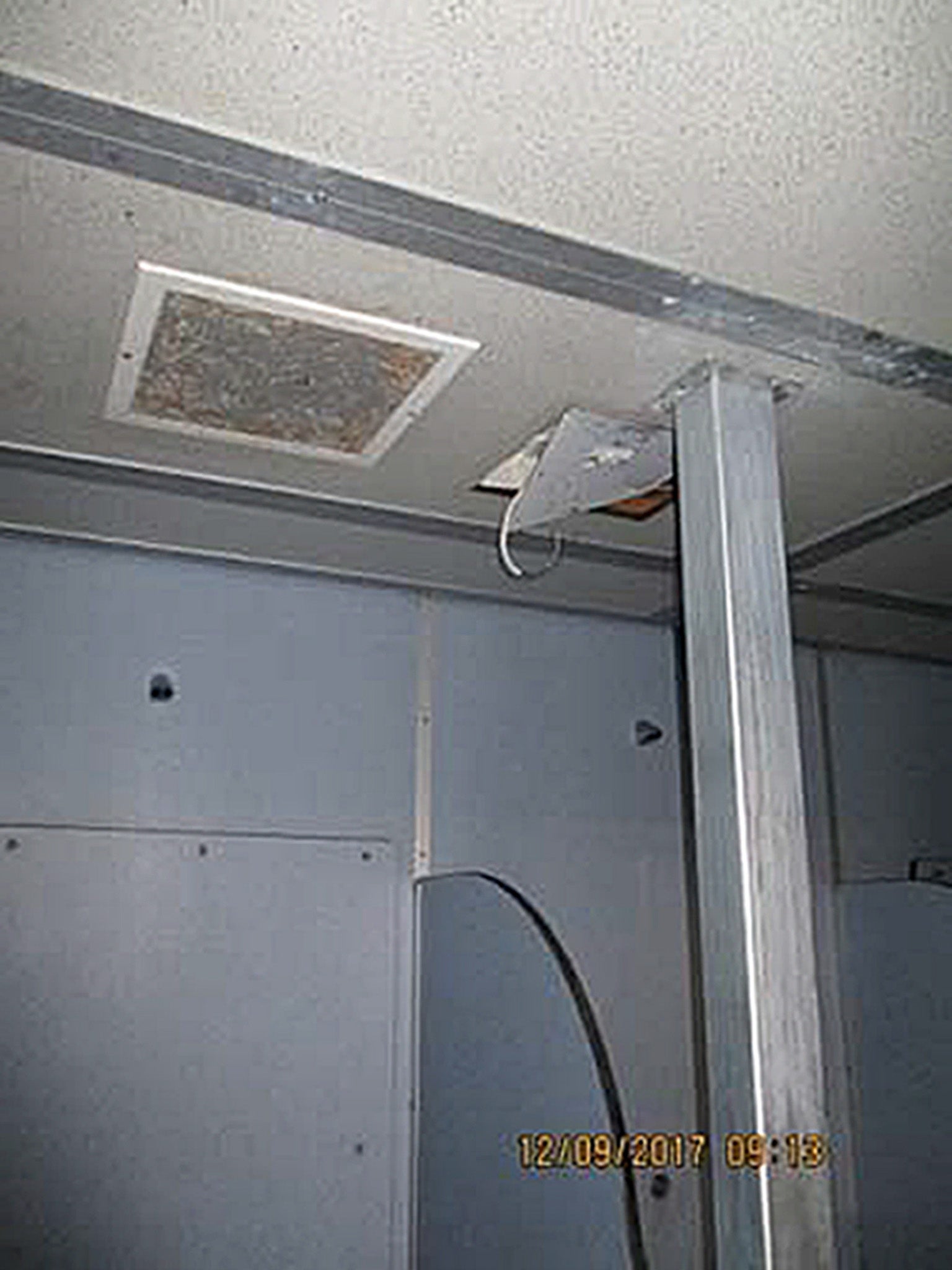 A shower unit with protruding electric cable at HMP Liverpool