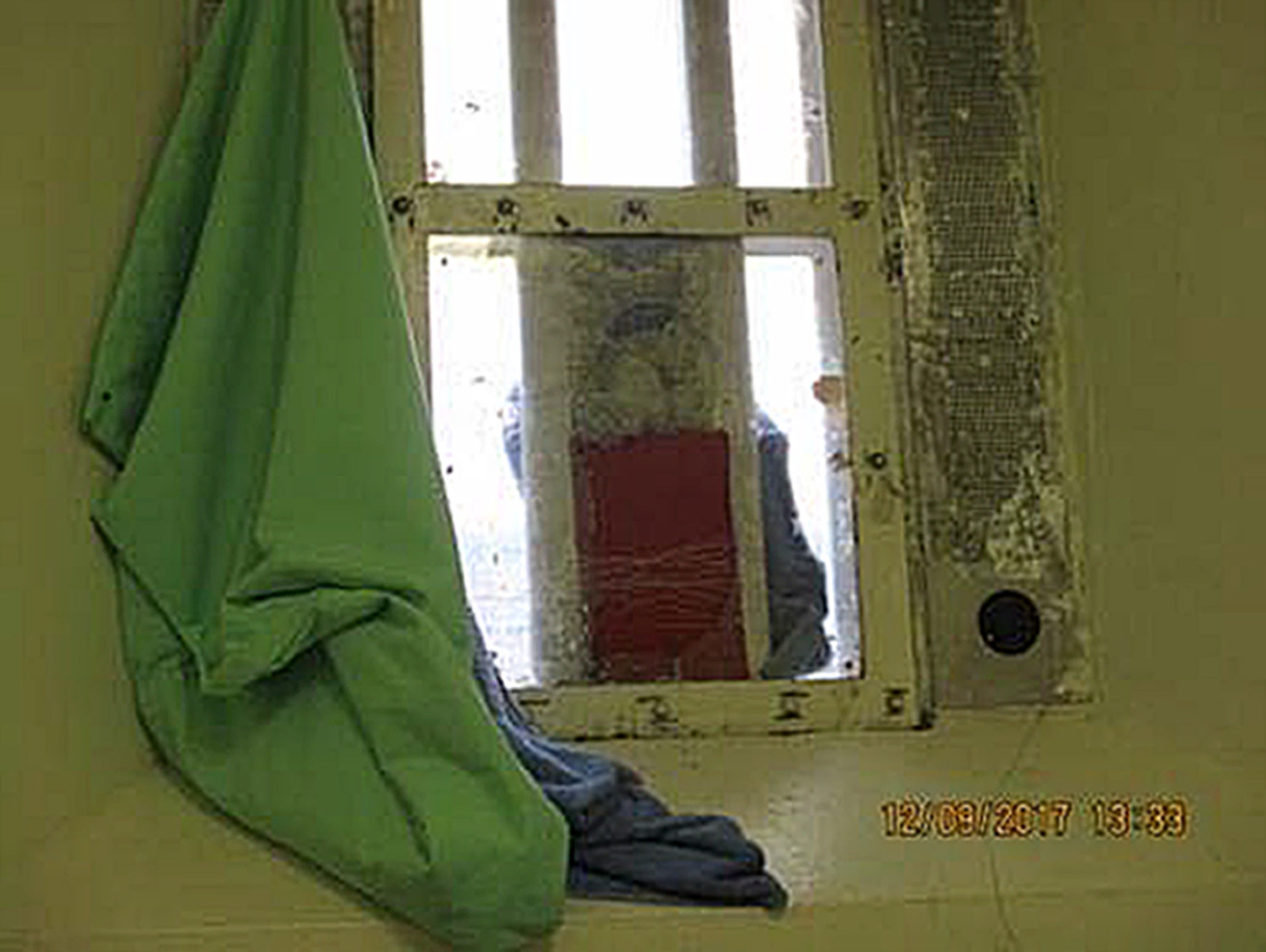 A broken window in a cell at HMP Liverpool