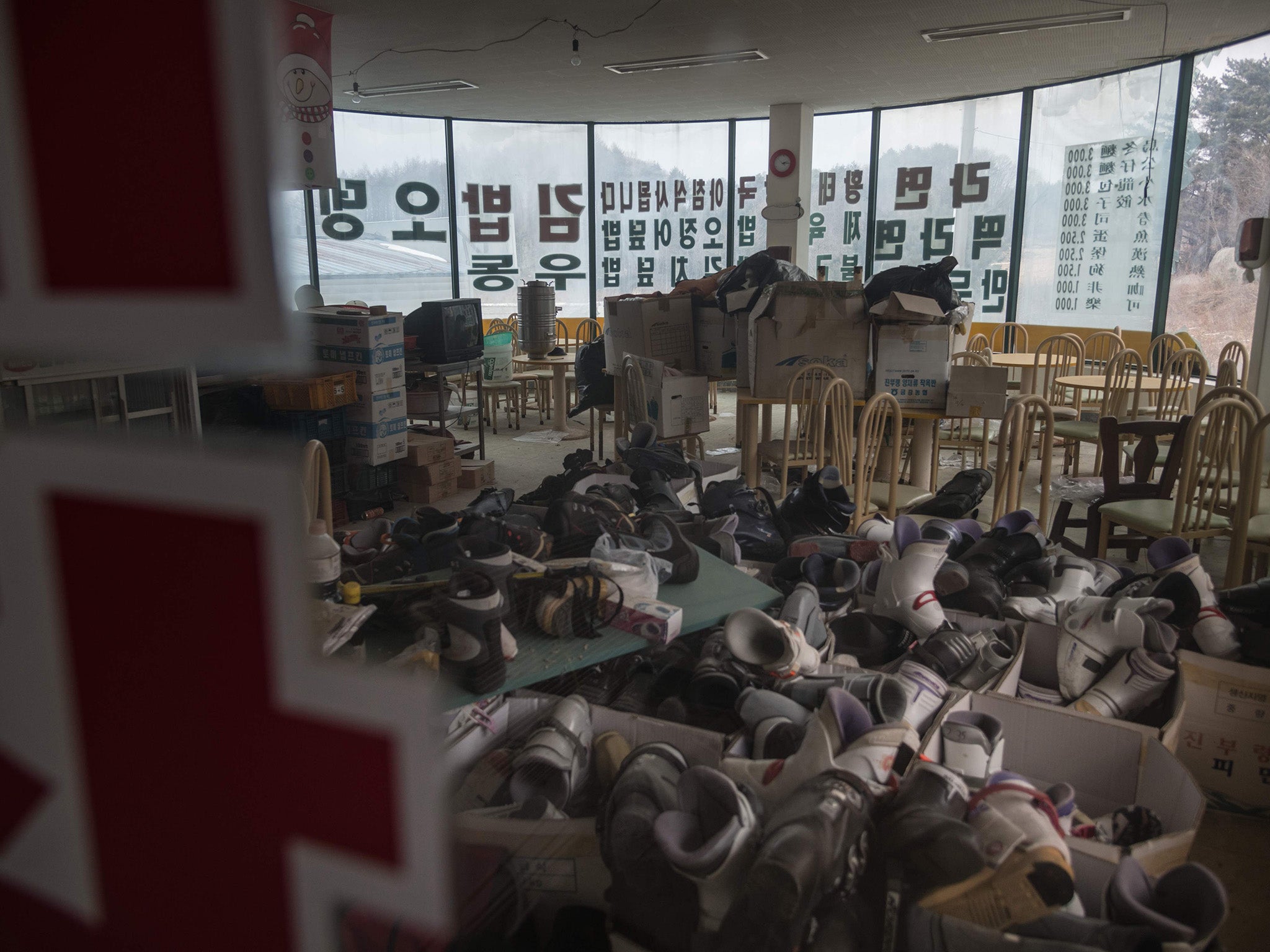 Ski boots piled up in a former restaurant