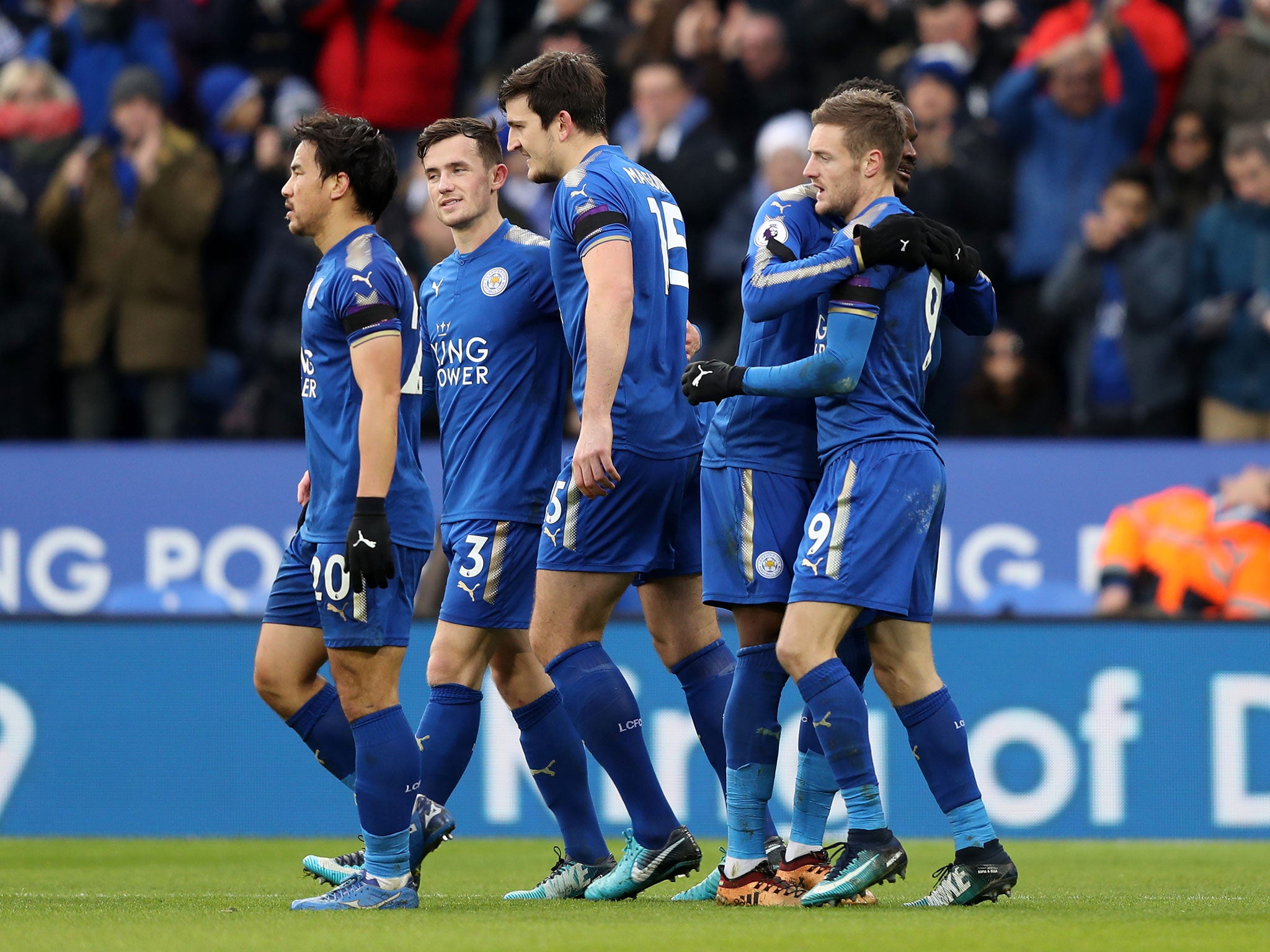 Jamie Vardy celebrates with teammates after converting his penalty