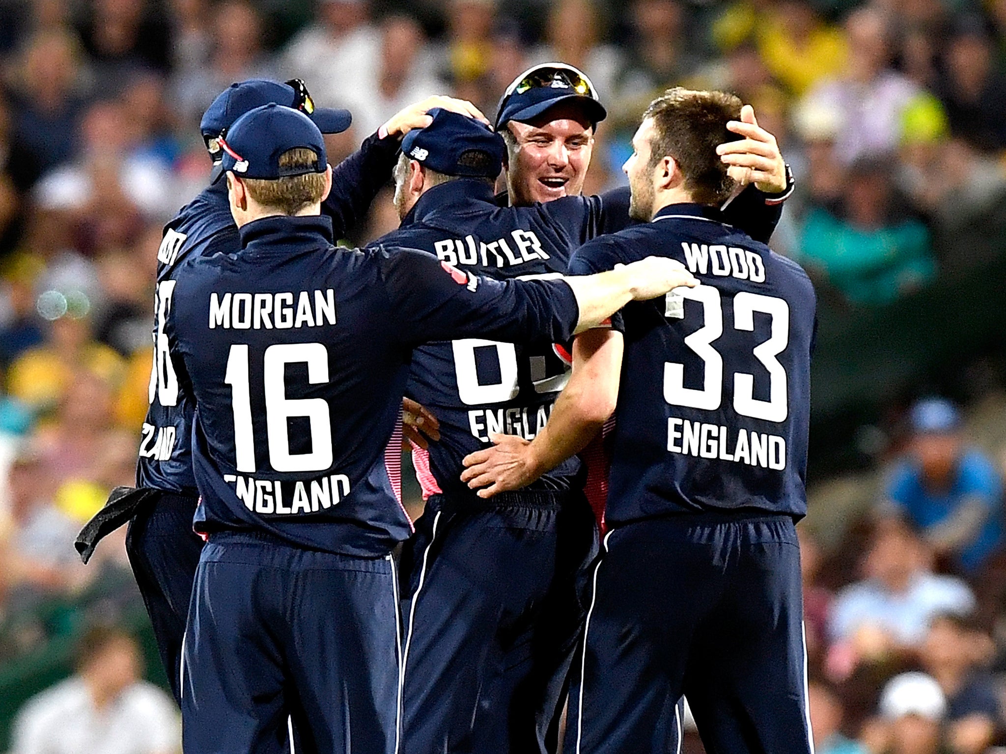 England celebrate their 16-run victory over Australia