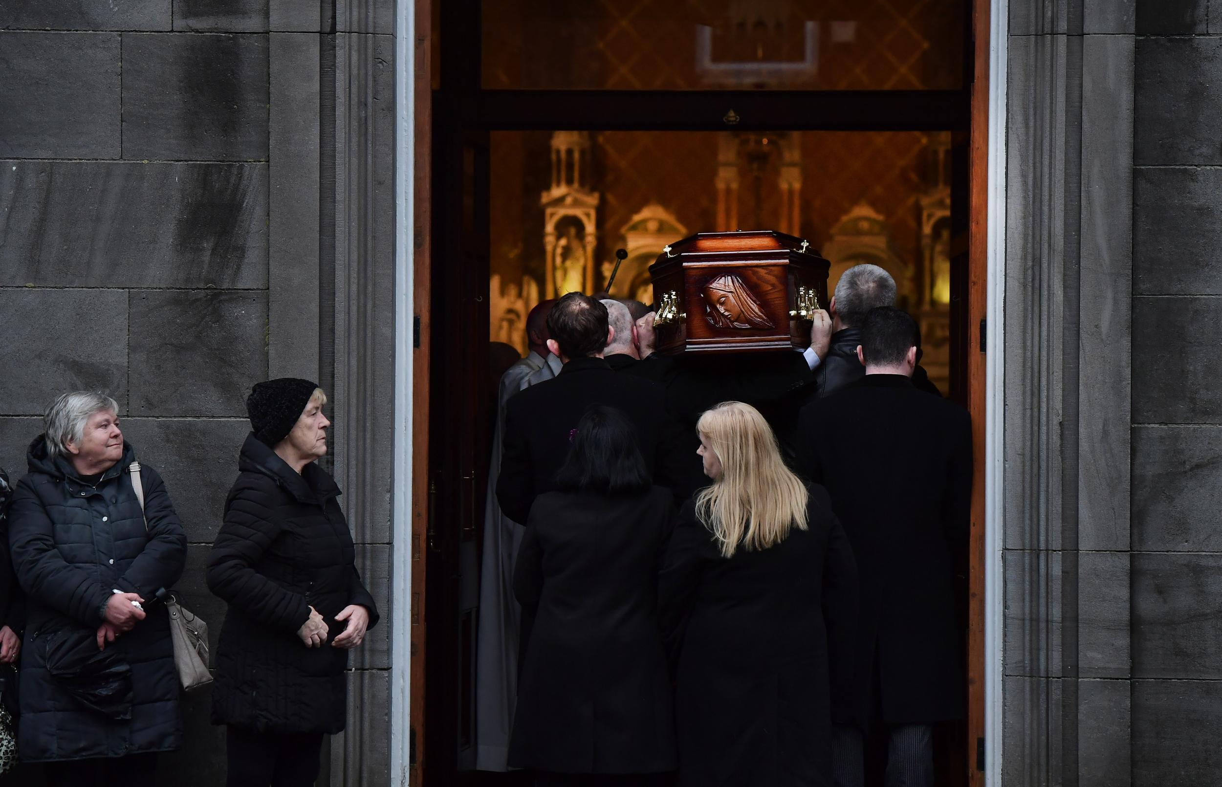 Eileen O'Riordan follows her daughter’s remains as she is carried into St Joseph’s Church